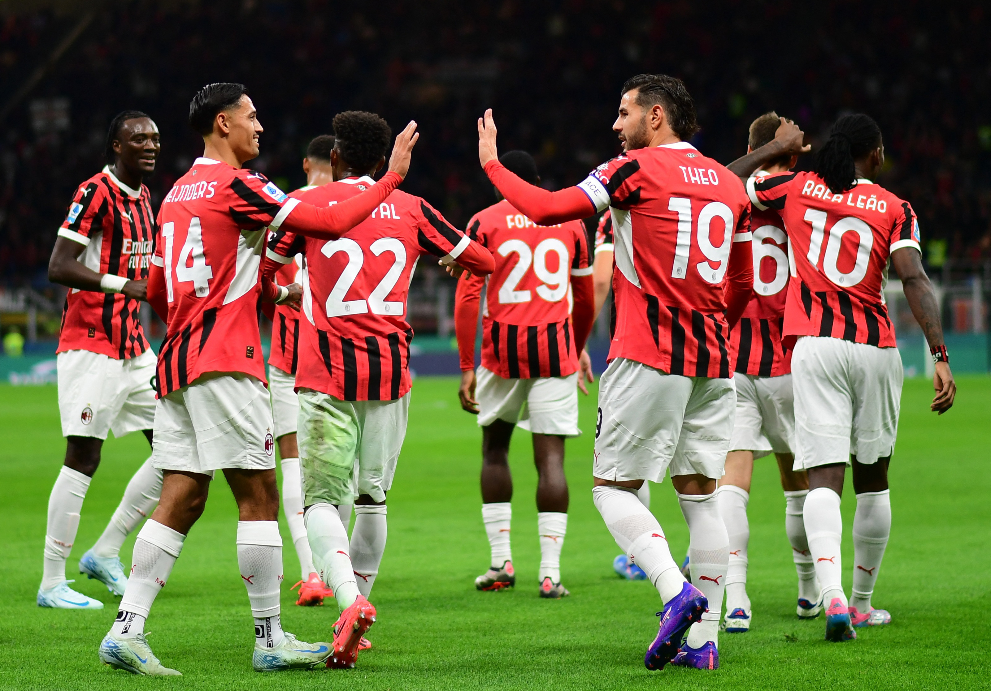 Soccer Football - Serie A - AC Milan v Venezia - San Siro, Milan, Italy - September 14, 2024 AC Milan's Theo Hernandez, Tijjani Reijnders and teammates celebrate after Matteo Gabbia scored their second goal REUTERS/Daniele Mascolo 