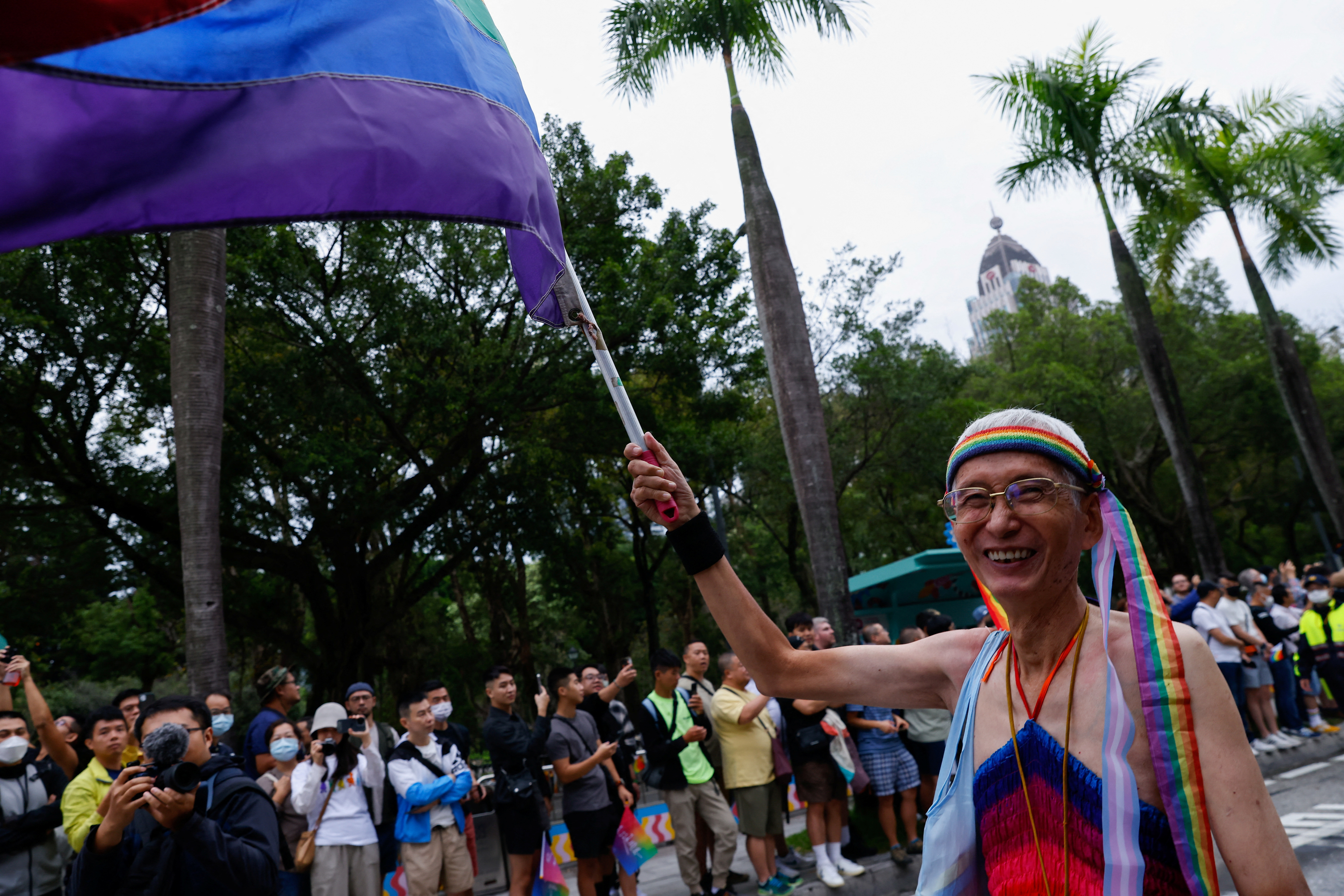 Taiwan's LGBT activist Chi Chia-wei waves a rainbow flag during the annual Taiwan's Pride parade in Taipei,