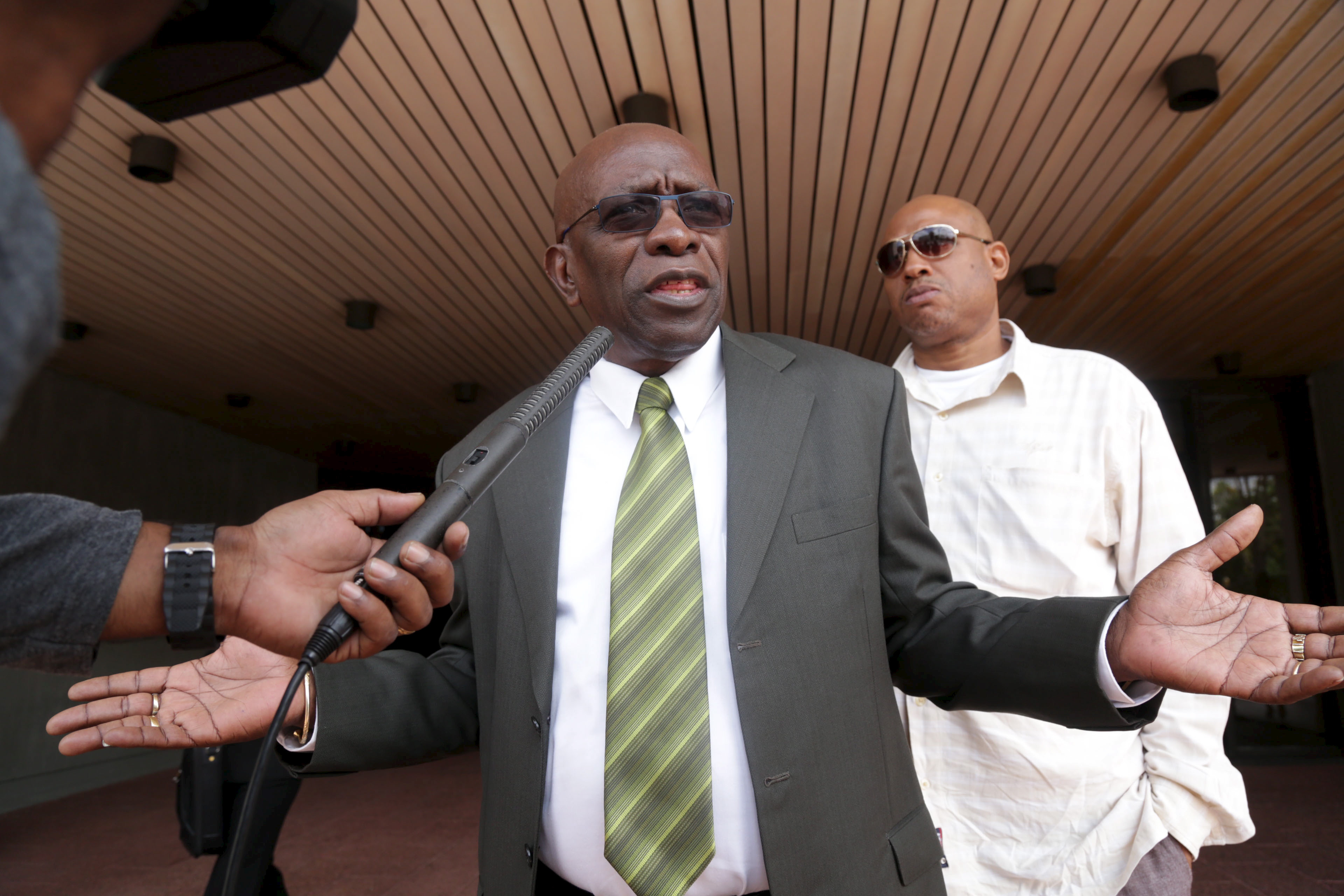 Warner talks to the media outside Hall of Justice in the capital Port-of-Spain