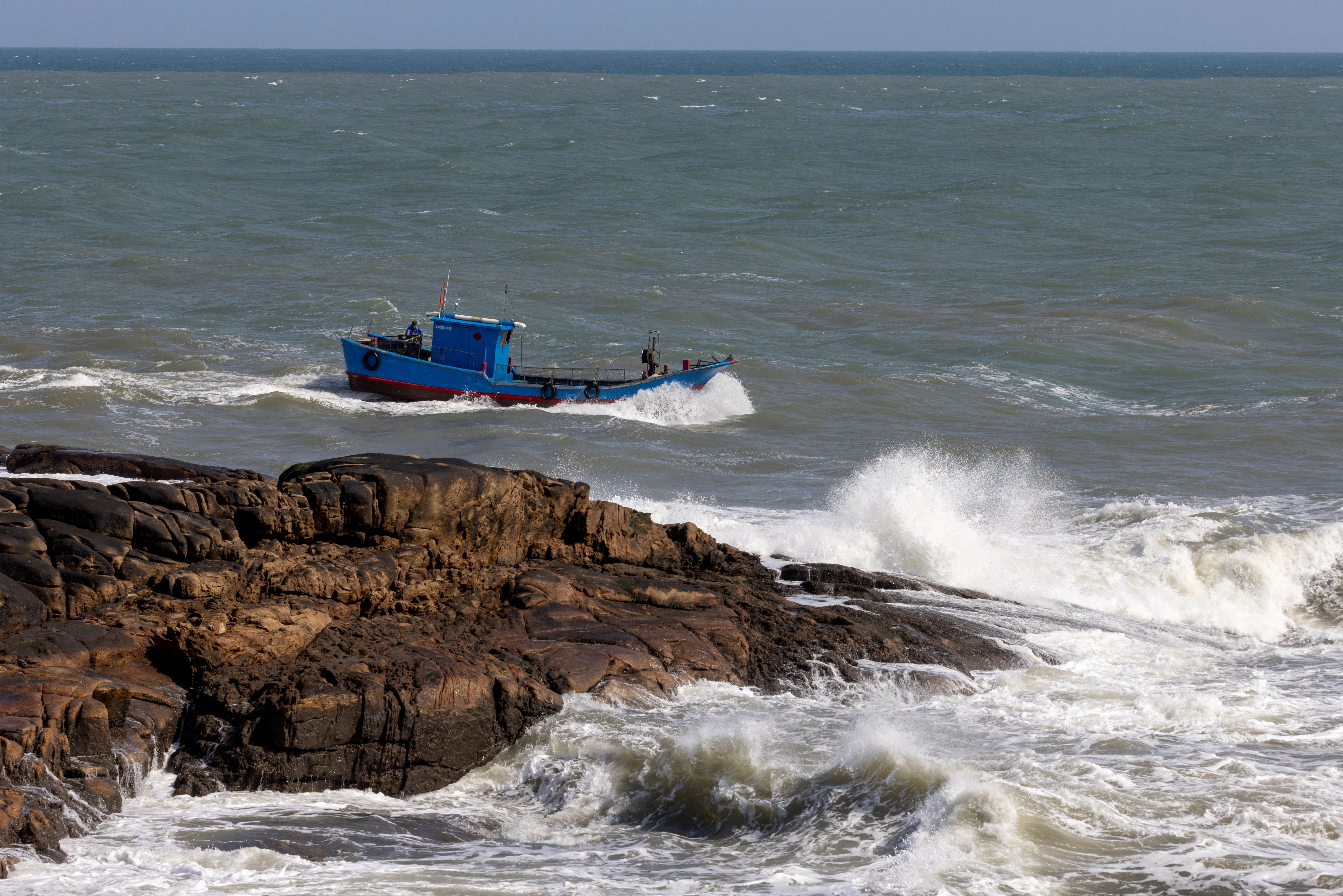 A Chinese fishing boat sails across the Taiwan strait off the coast of Pingtan Island