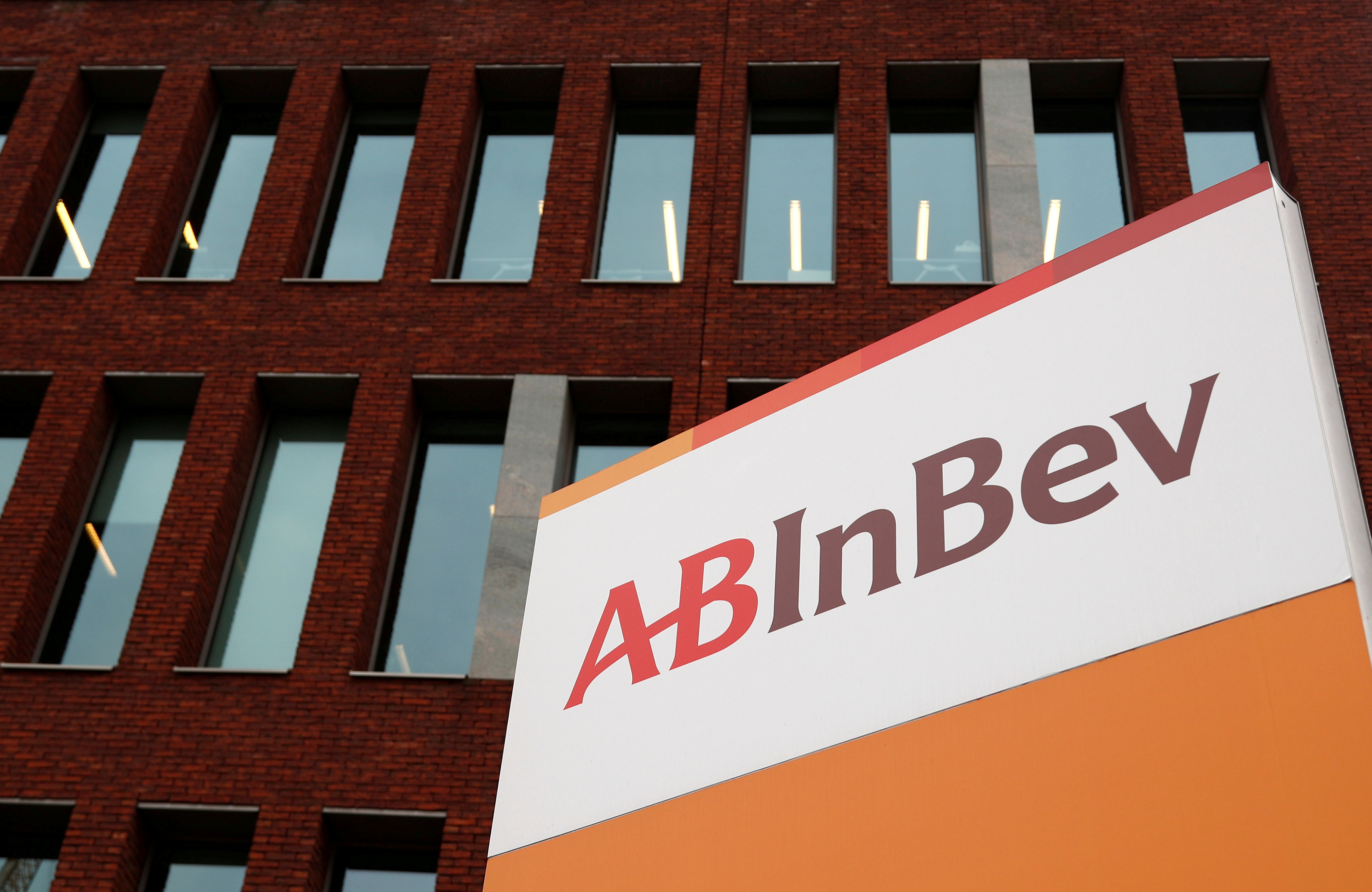 The logo of AB InBev is pictured outside the brewer's headquarters in Leuven