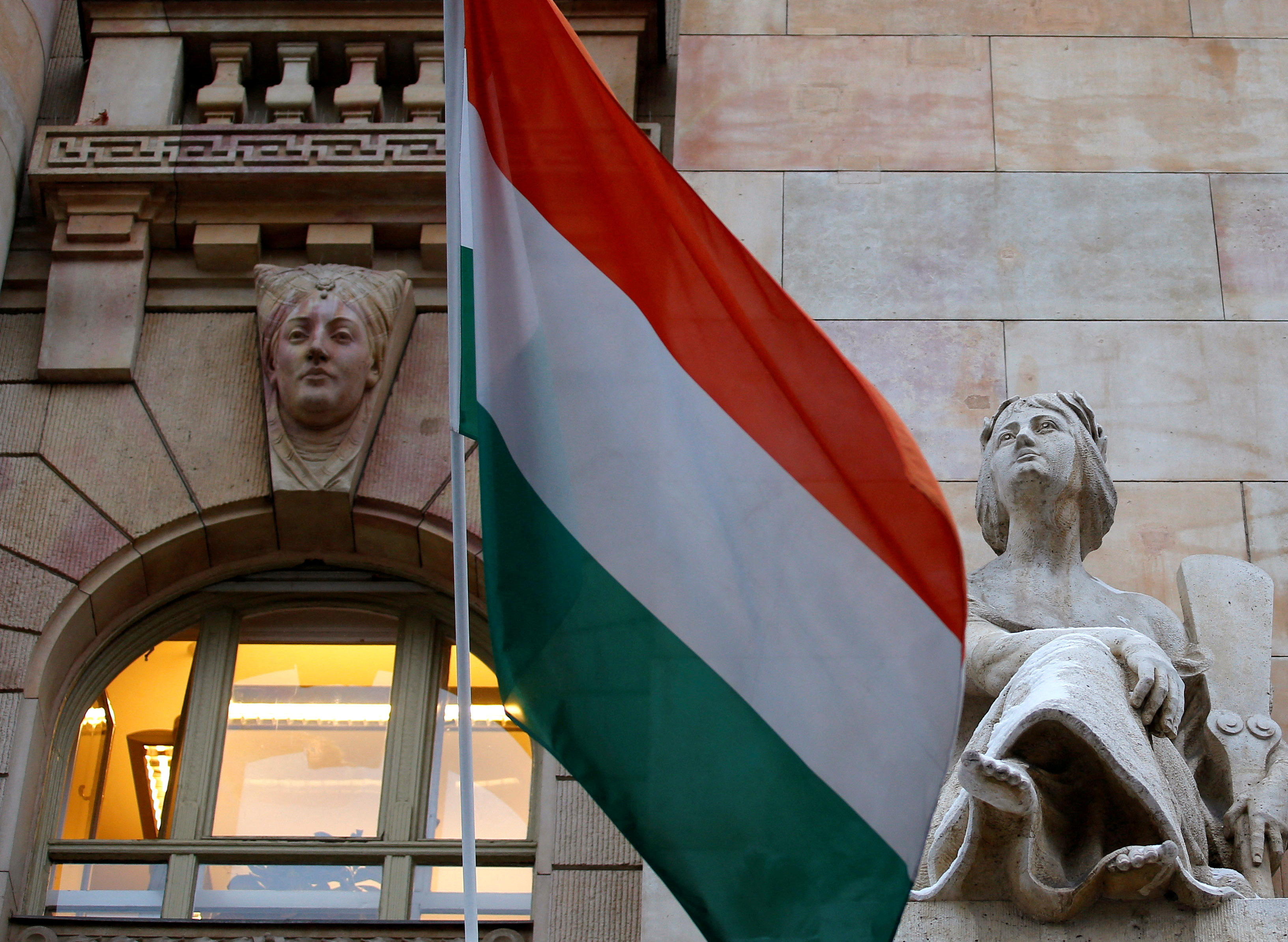 The Hungarian national flag flies on the building of the National Bank of Hungary in Budapest