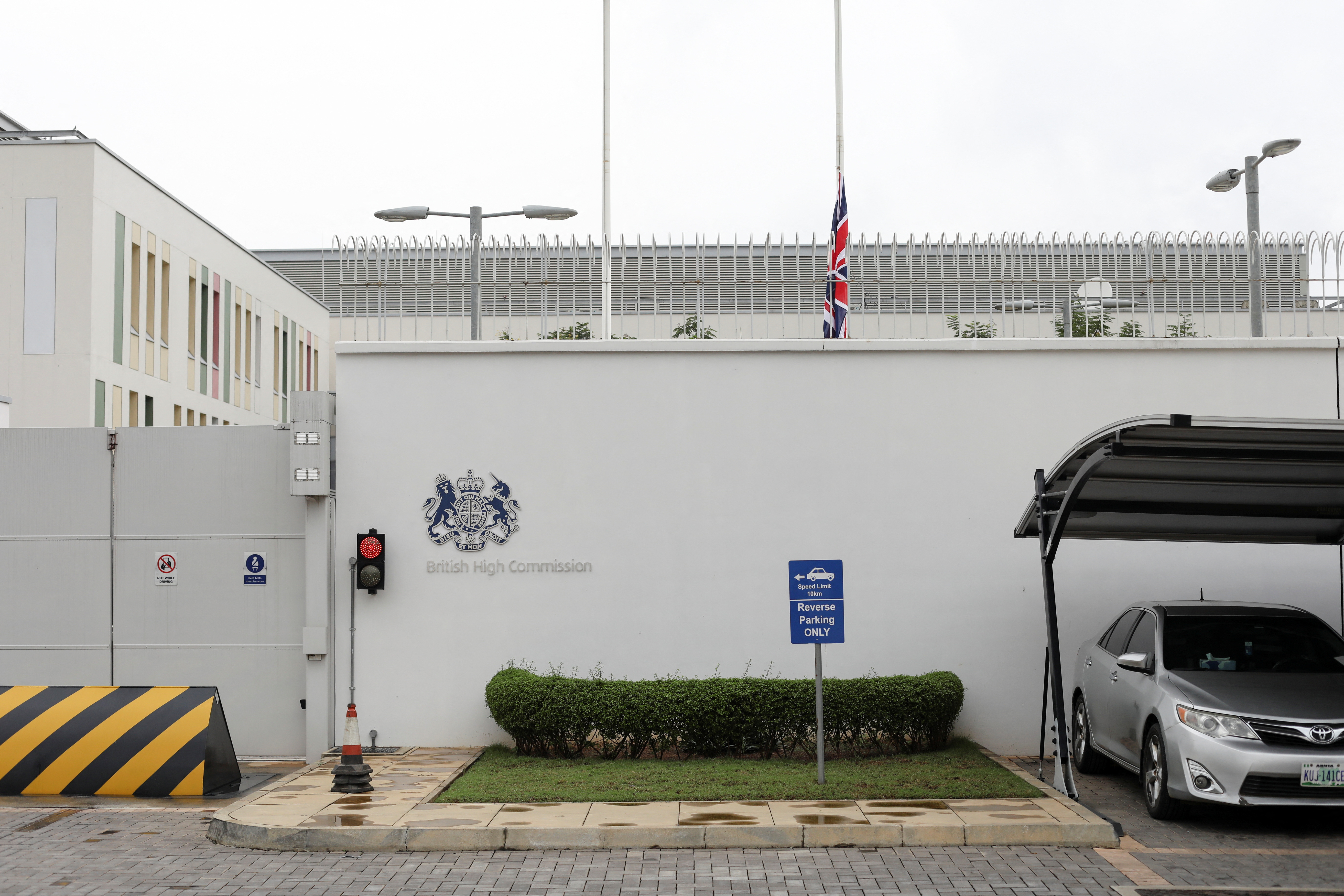 British flag is seen flying at half mast at the British High Commission in Abuja