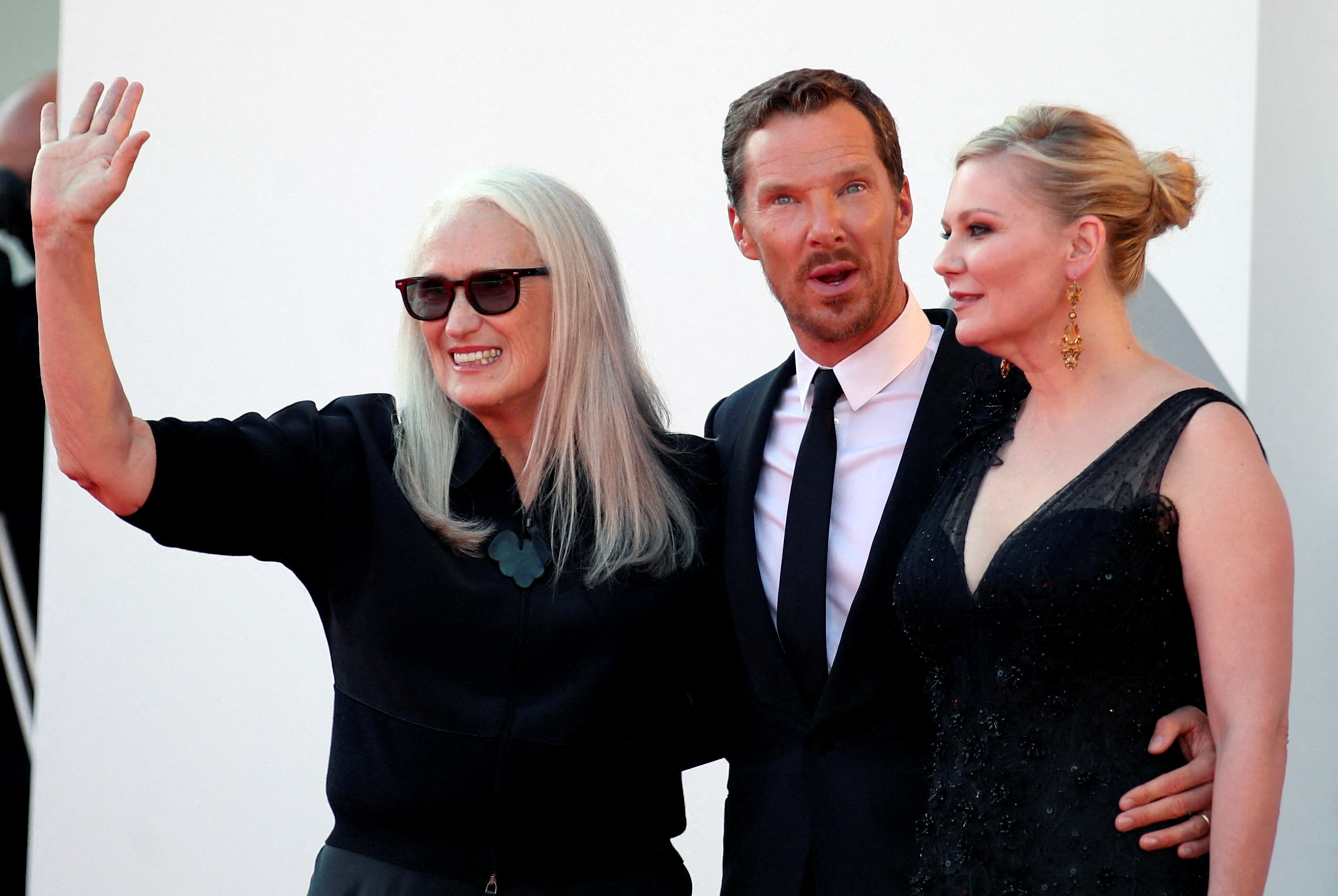 The 78th Venice Film Festival - Screening of the film 'The Power of the Dog' in competition - Red Carpet Arrivals - Venice, Italy September 2, 2021 - Director Jane Campion, actor Benedict Cumberbatch and actor Kirsten Dunst pose. REUTERS/Yara Nardi/File Photo