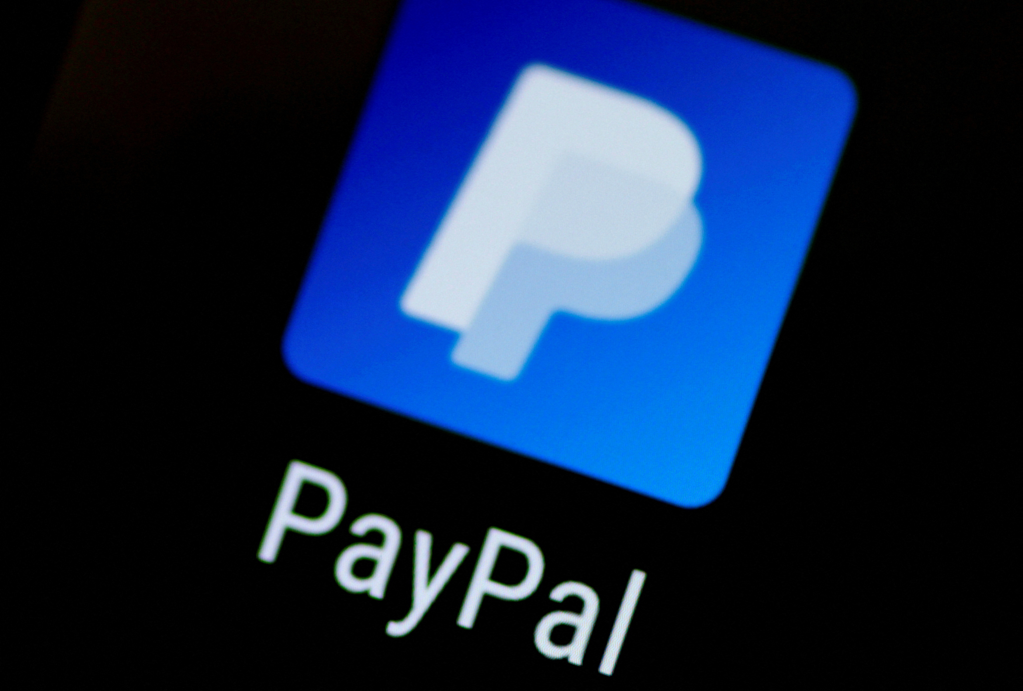 Illustration photo of the PayPal app on a phone