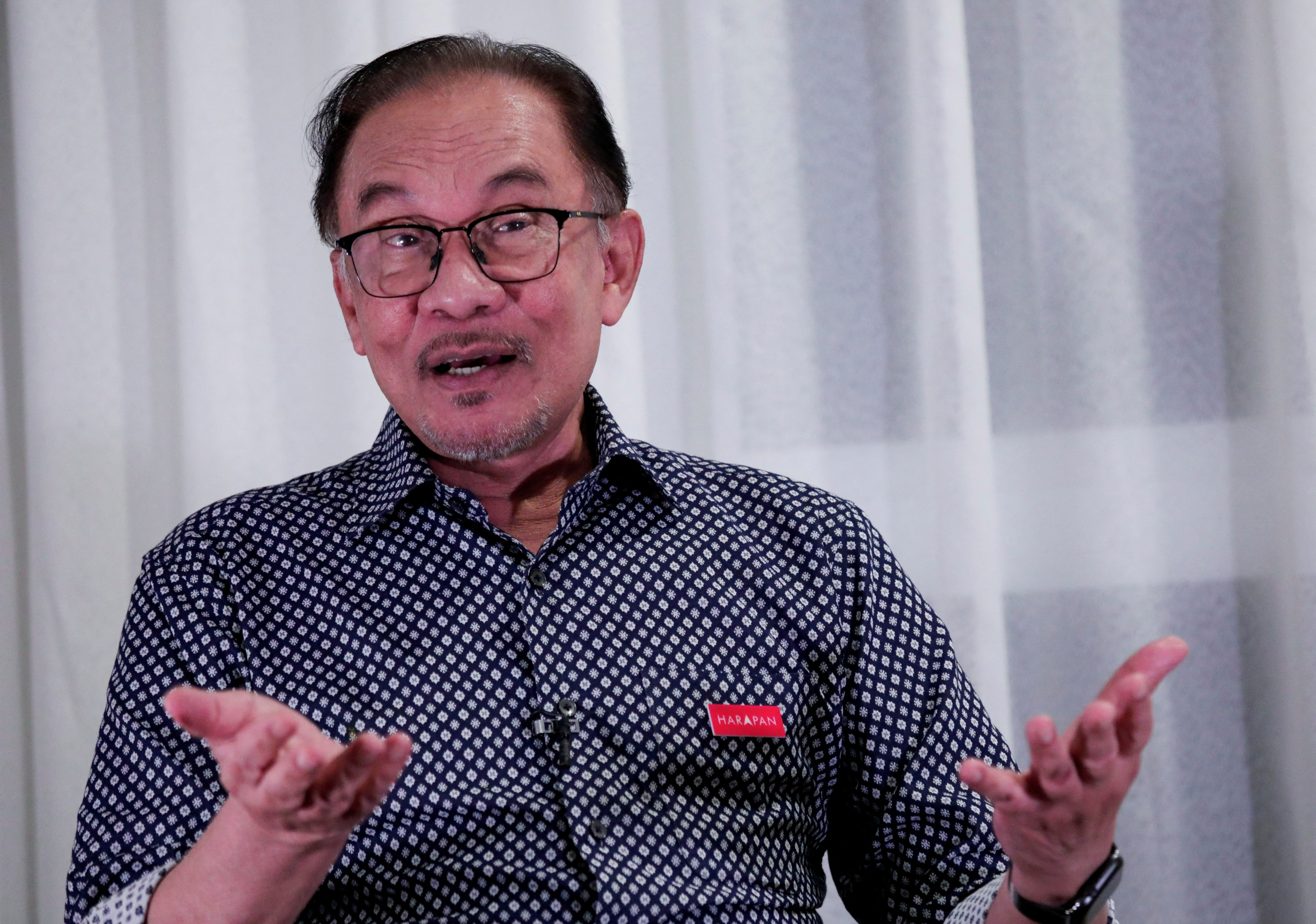 Malaysian opposition leader Anwar Ibrahim speaks during an interview in Tambun