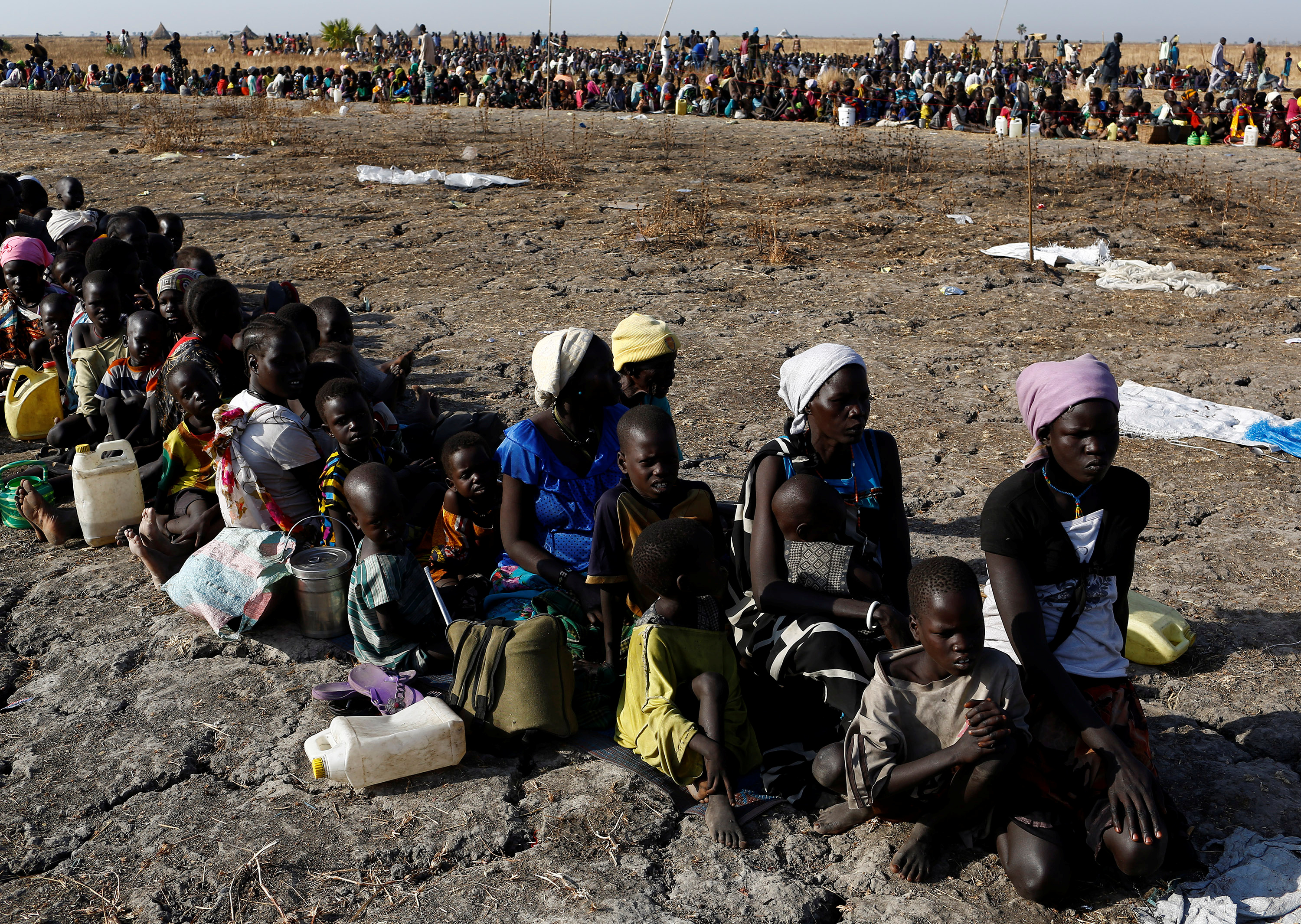 Women and children wait to be registered prior to a food distribution carried out by the United Nations World Food Programme (WFP) in Thonyor, Leer state