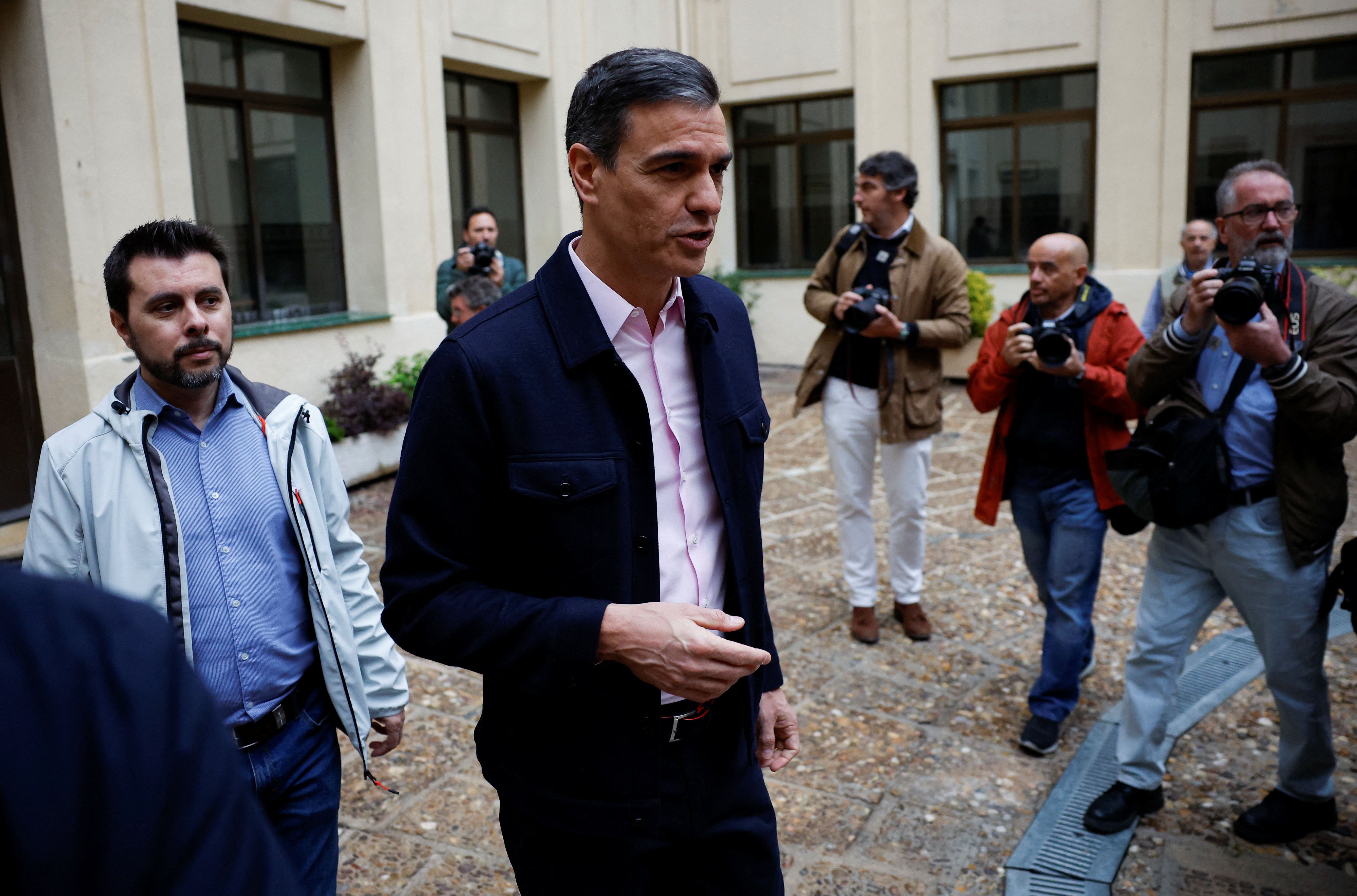 Spain's Prime Minister Pedro Sanchez appears after he casts his vote at a polling station in Madrid
