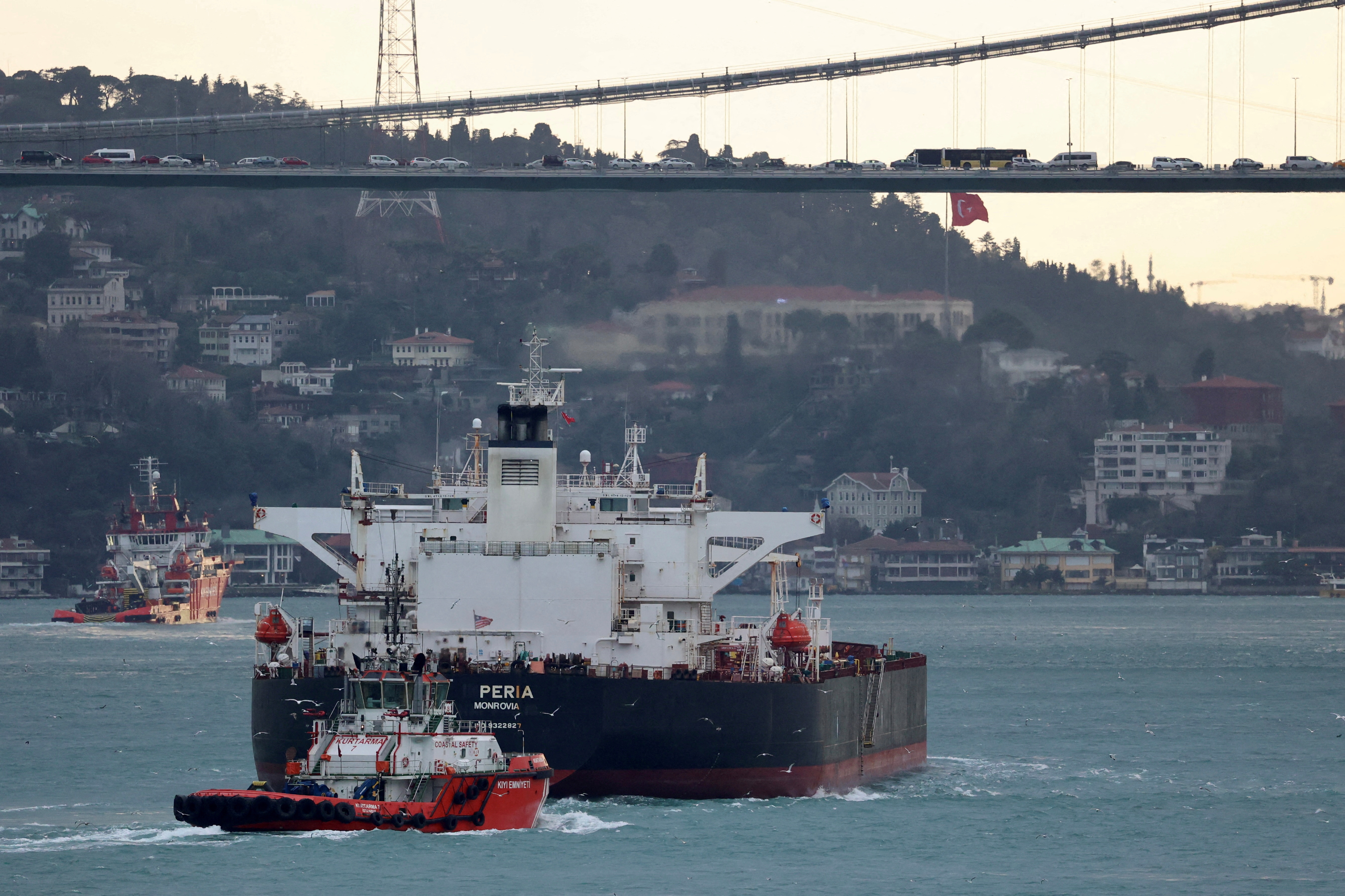 Liberia-flagged tanker Peria is escorted by a Turkish coastal safety boat as it transits Istanbul's Bosphorus