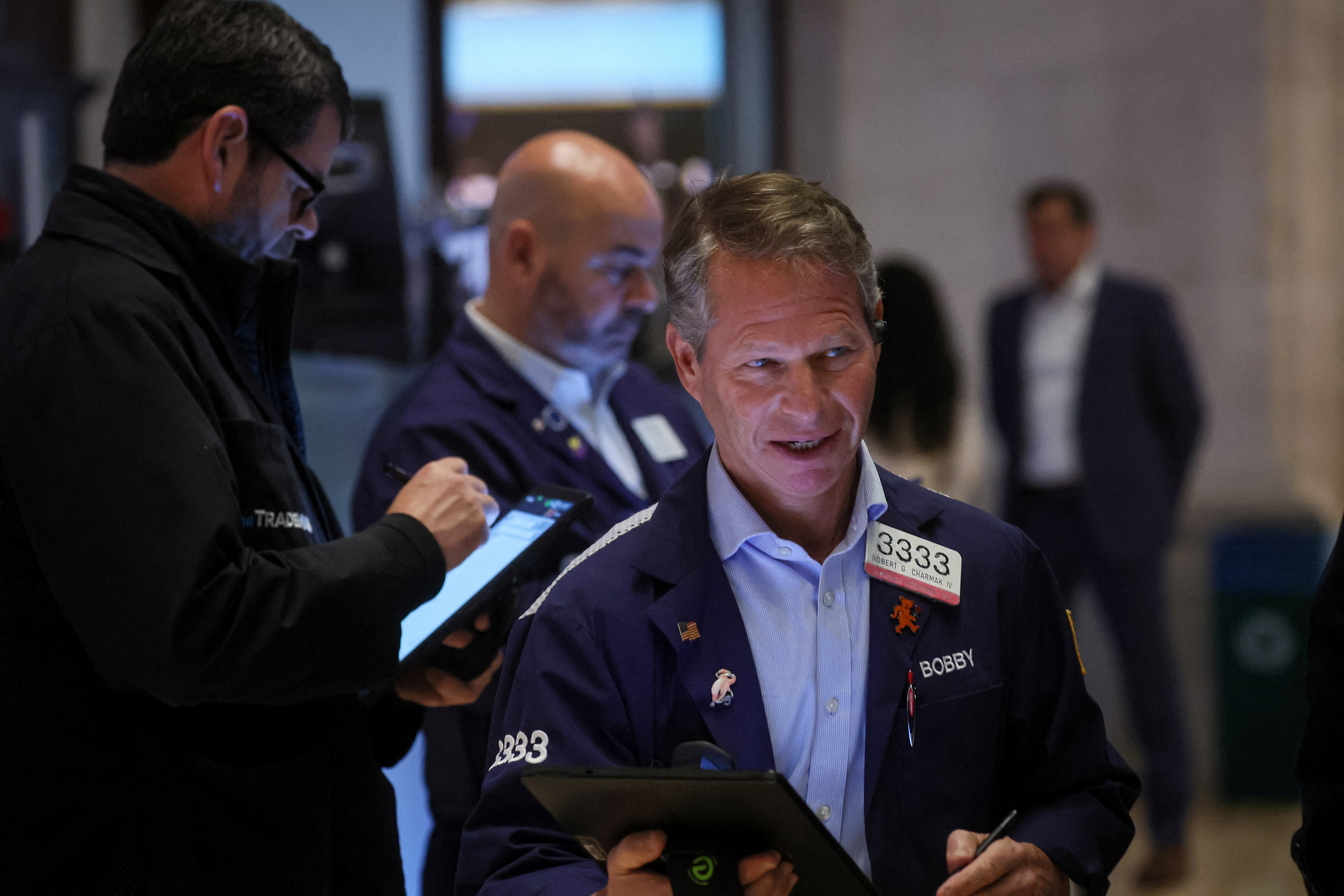 Traders work on the floor of the NYSE in New York
