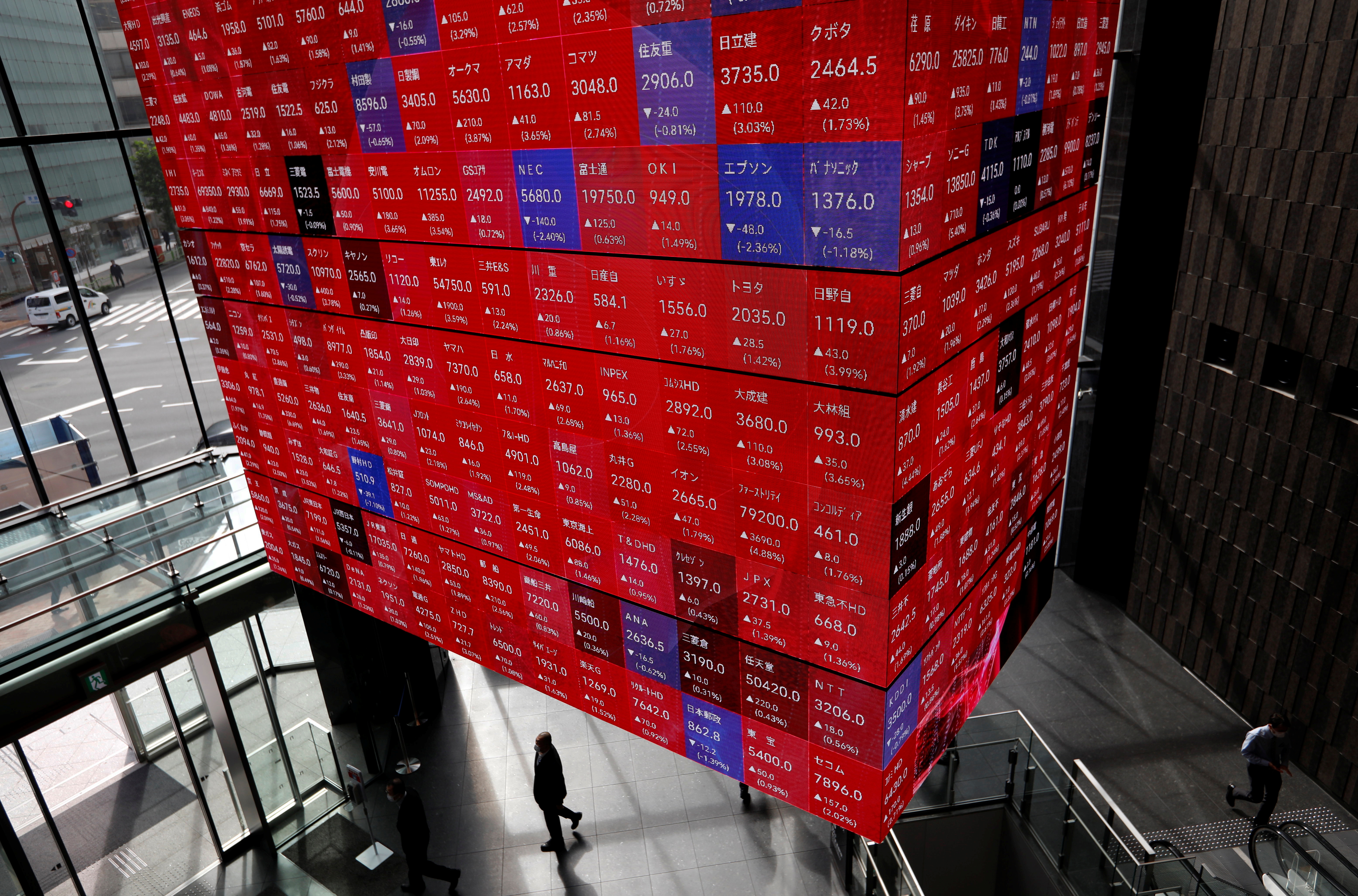 An electronic stock quotation board is displayed inside a conference hall in Tokyo, Japan November 1, 2021. REUTERS/Issei Kato