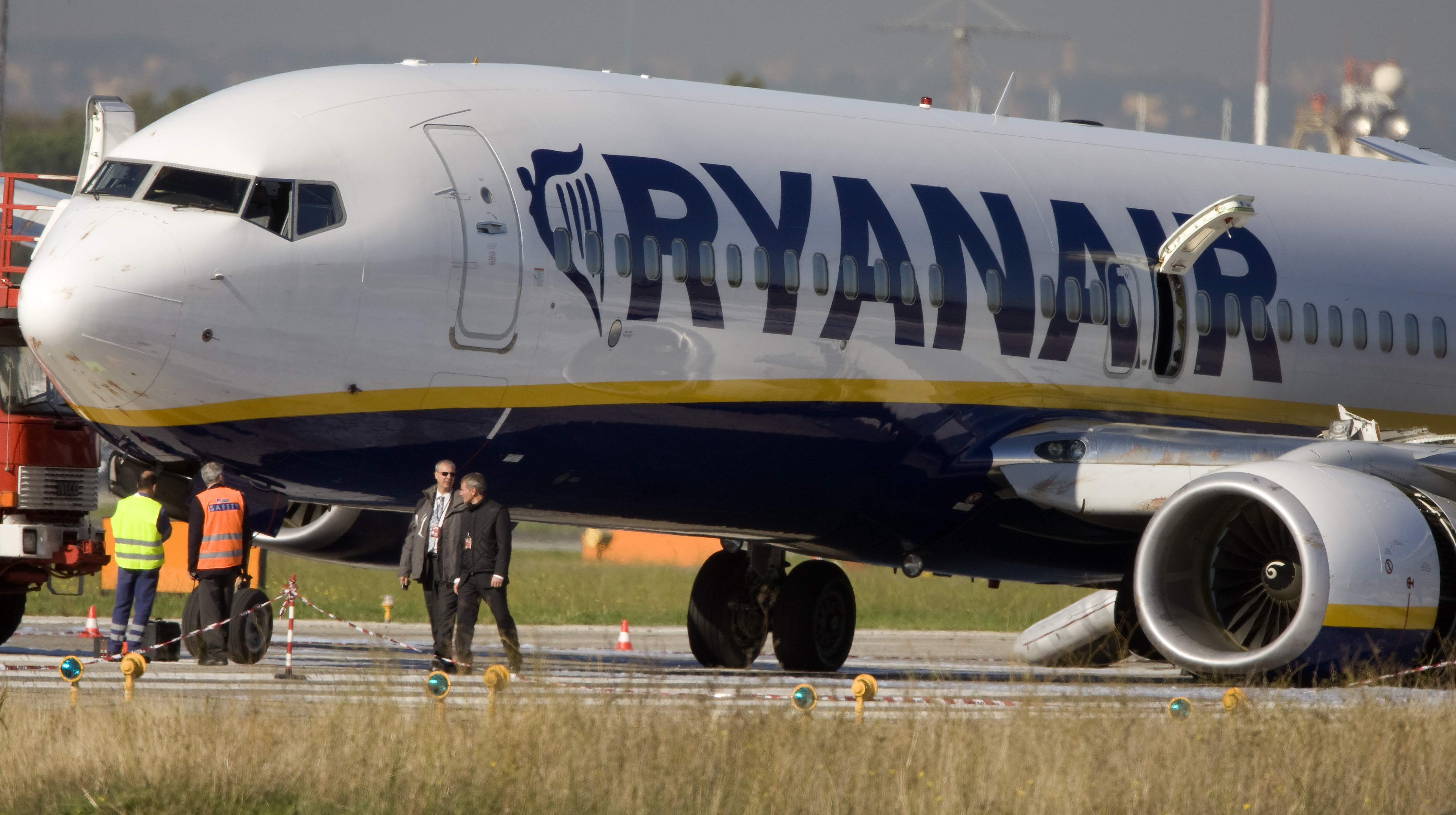 Ryanair jet lies on the runway with collapsed landing gear after an emergency landing at Ciampino airport in Rome