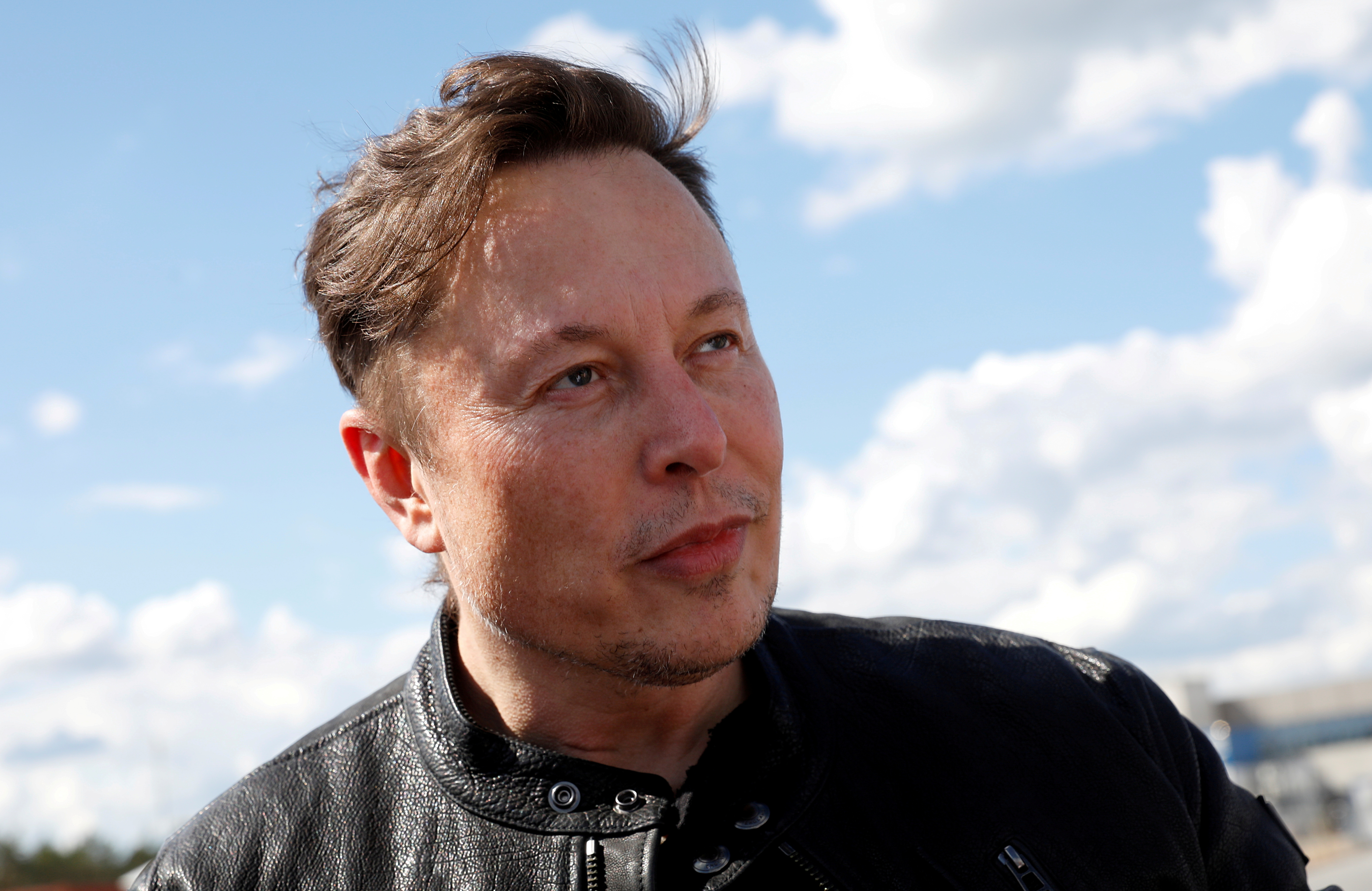 SpaceX founder and Tesla CEO Elon Musk looks on as he visits the construction site of Tesla's gigafactory in Gruenheide, near Berlin, Germany, May 17, 2021. REUTERS/Michele Tantussi/File Photo