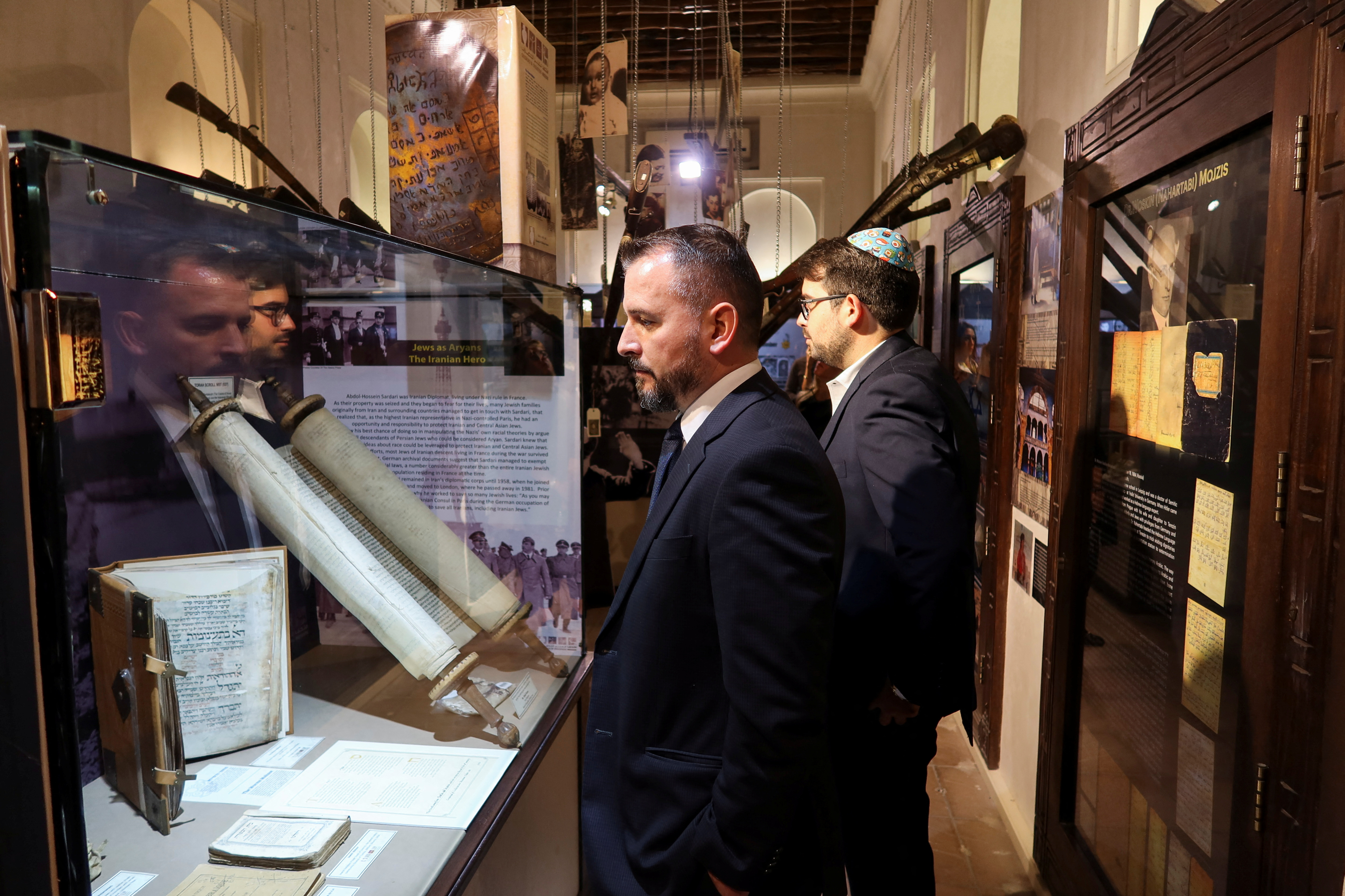 Visitors attend an event commemorating the Holocaust at Crossroad of Civilizations Museum, in Dubai