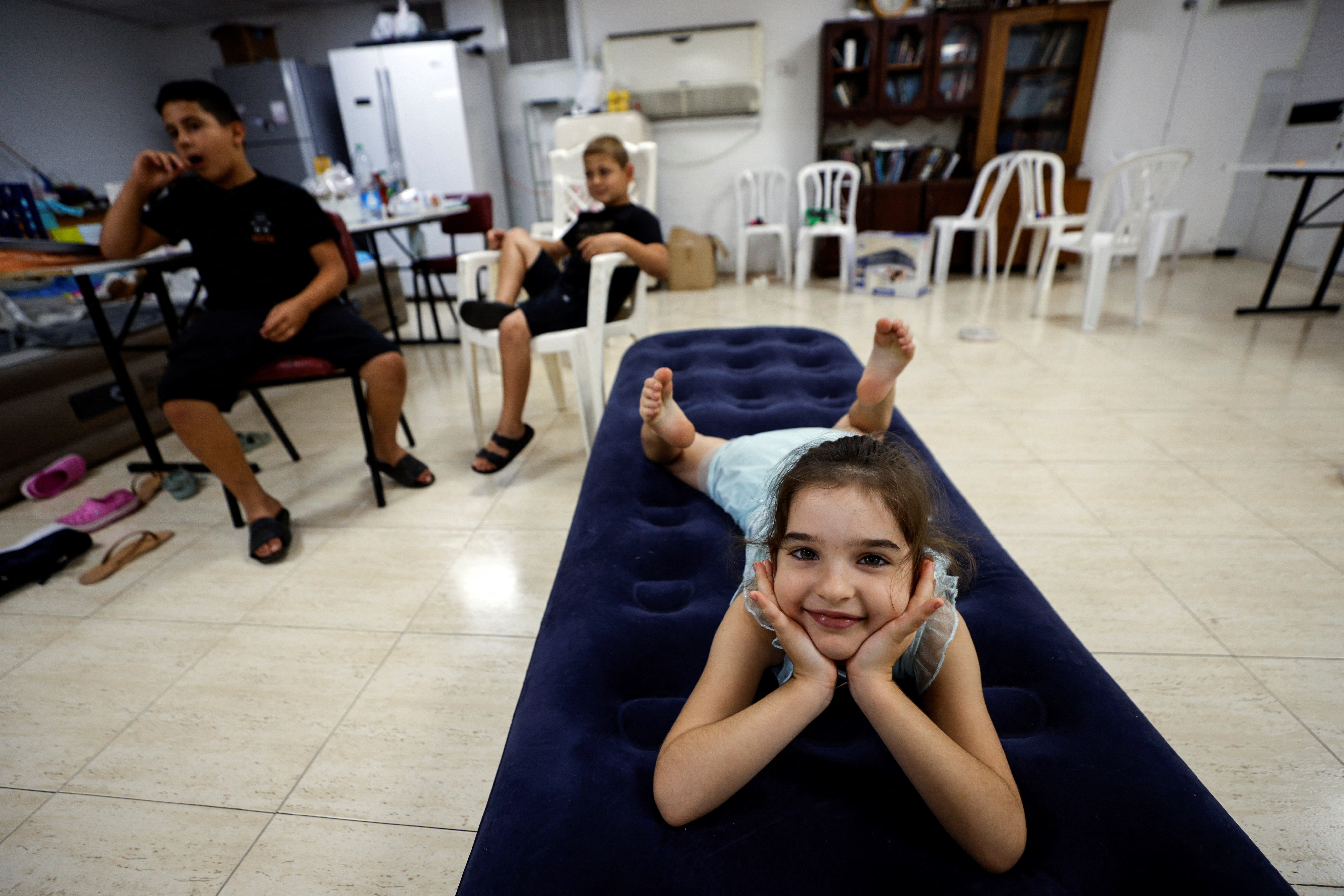 Children stay in a bomb shelter following rockets fired from Gaza towards Israel, in Ashkelon