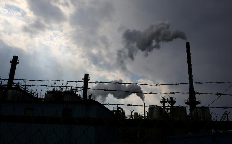 FILE PHOTO: Steam rises from a chemical plant in an industrial zone in Hamilton