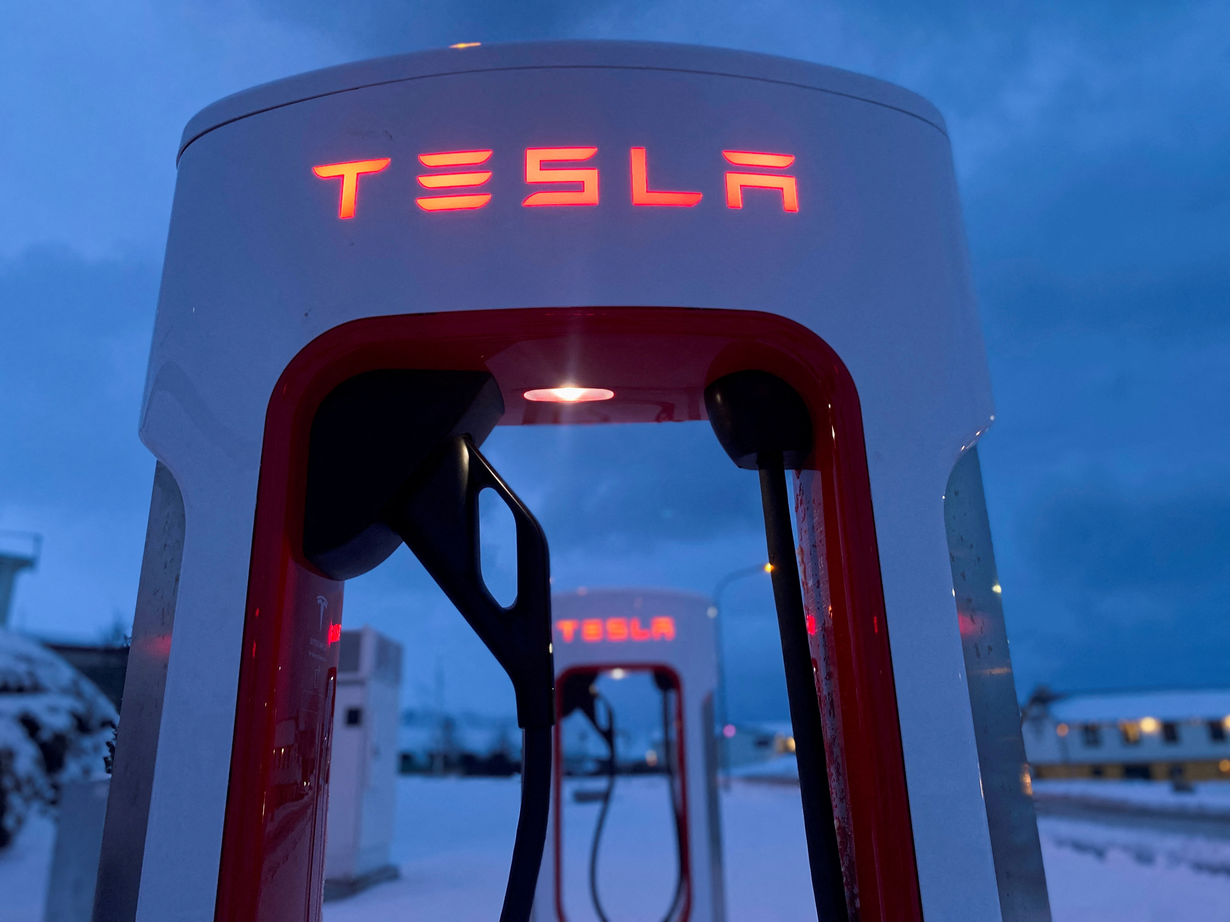 Tesla electric vehicle chargers are seen during the winter in Hofn