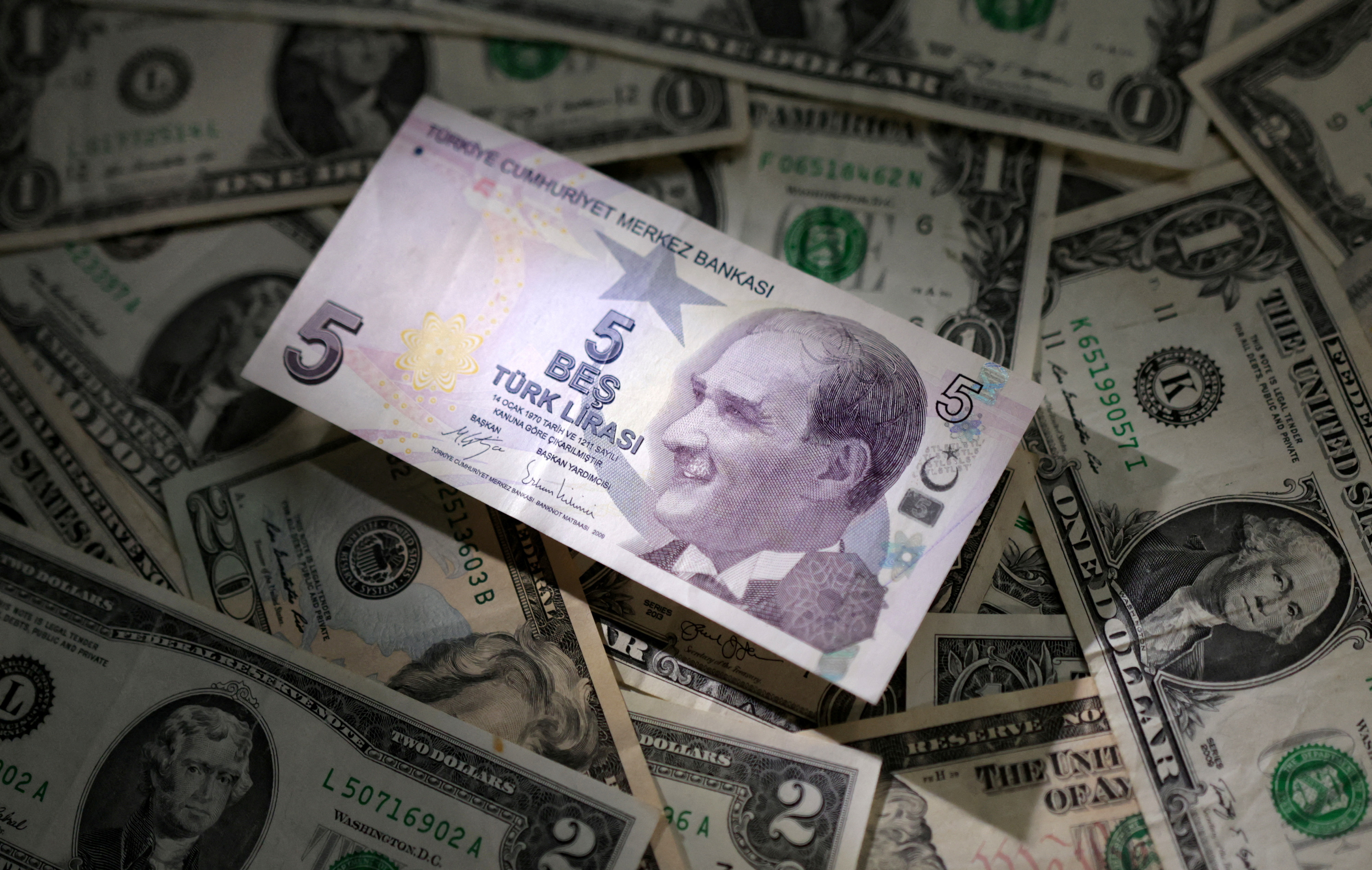 Illustration shows Turkish Lira and U.S. dollar banknotes