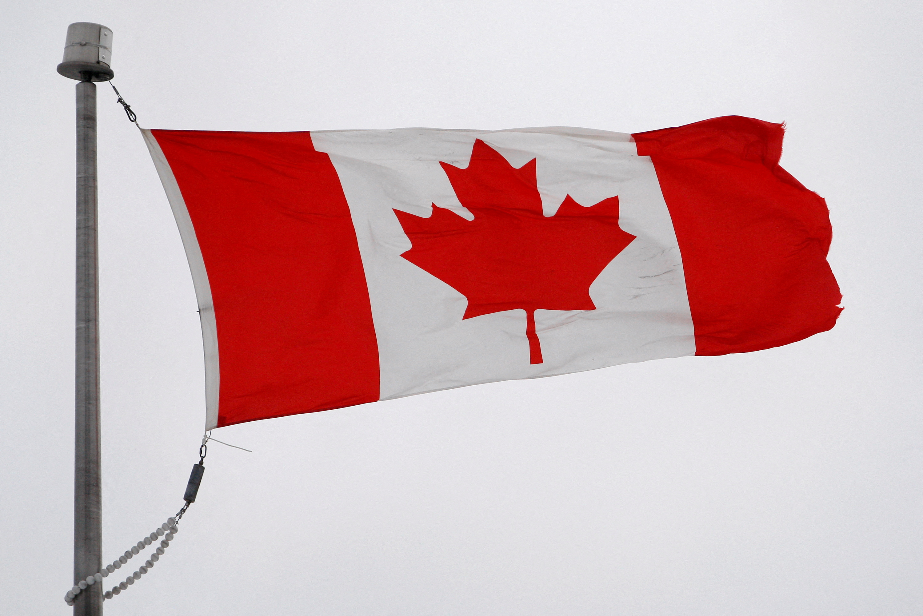 The Canadian flag flutters in the wind in Quebec City