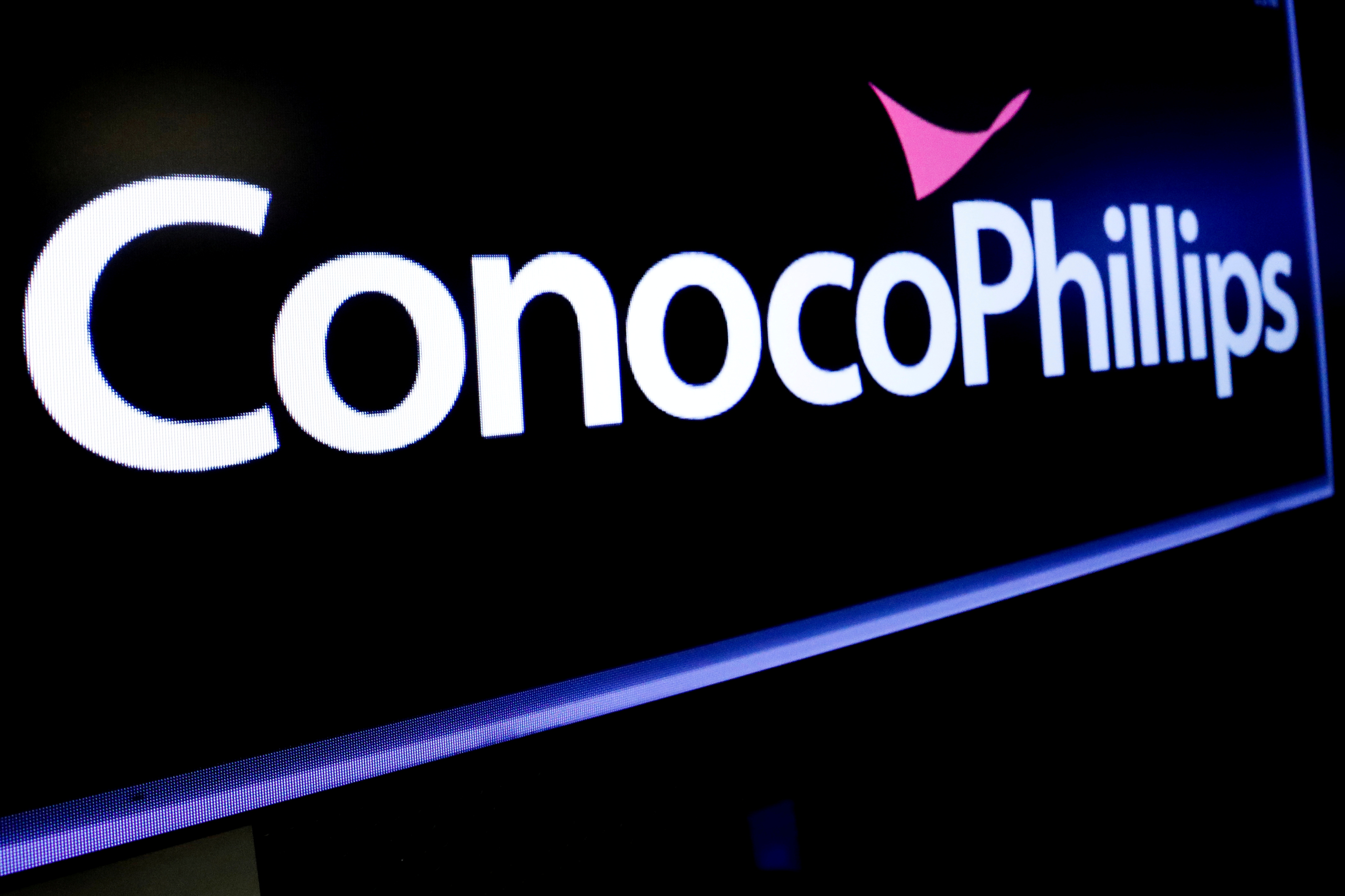 The logo for ConocoPhillips is displayed on a screen on the floor at the New York Stock Exchange (NYSE) in New York, U.S., January 13, 2020. REUTERS/Brendan McDermid/File Photo