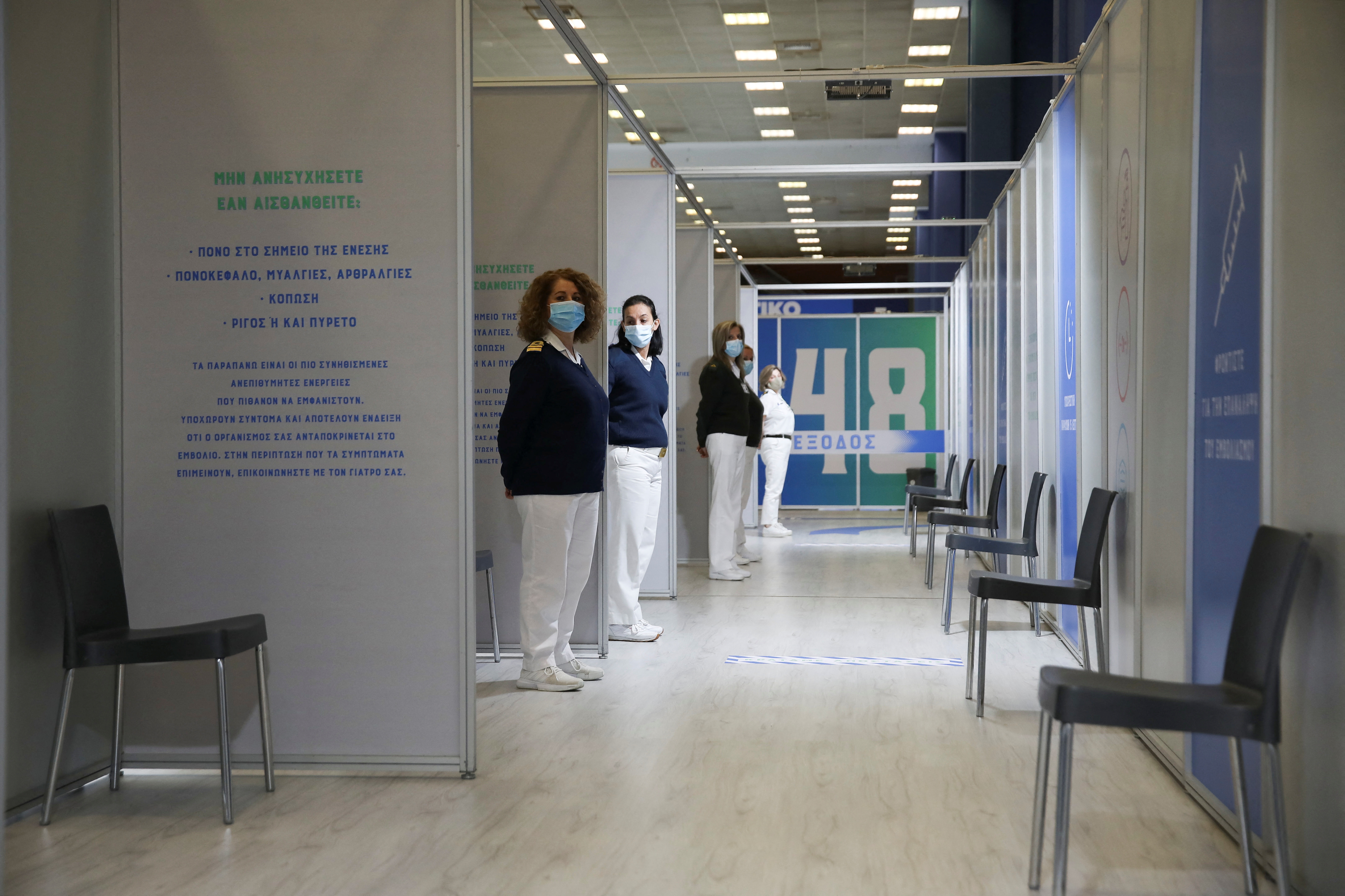 Greek Army Medical Personnel members stand at the hallway of a vaccination centre during a media tour, amid the coronavirus disease (COVID-19) pandemic, in Athens