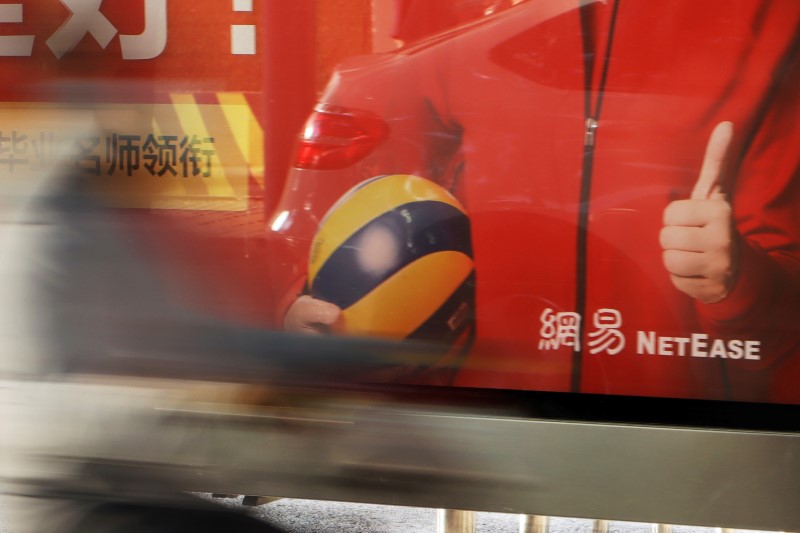 The logo of Chinese technology company NetEase is seen on an advertisement at a bus stop in Beijing