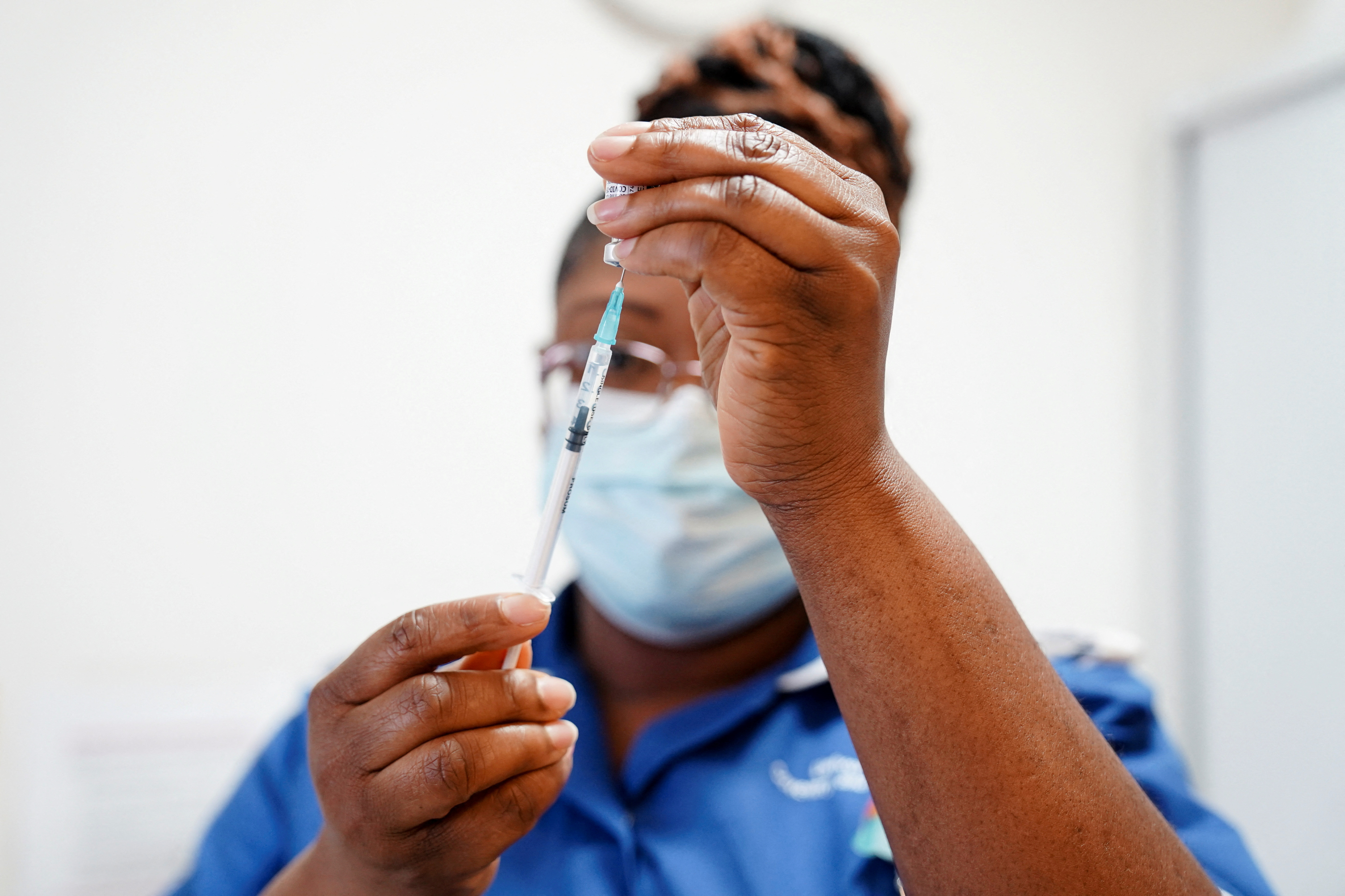 A nurse prepares a dose of a coronavirus disease (COVID-19) vaccine at the University Hospital Coventry