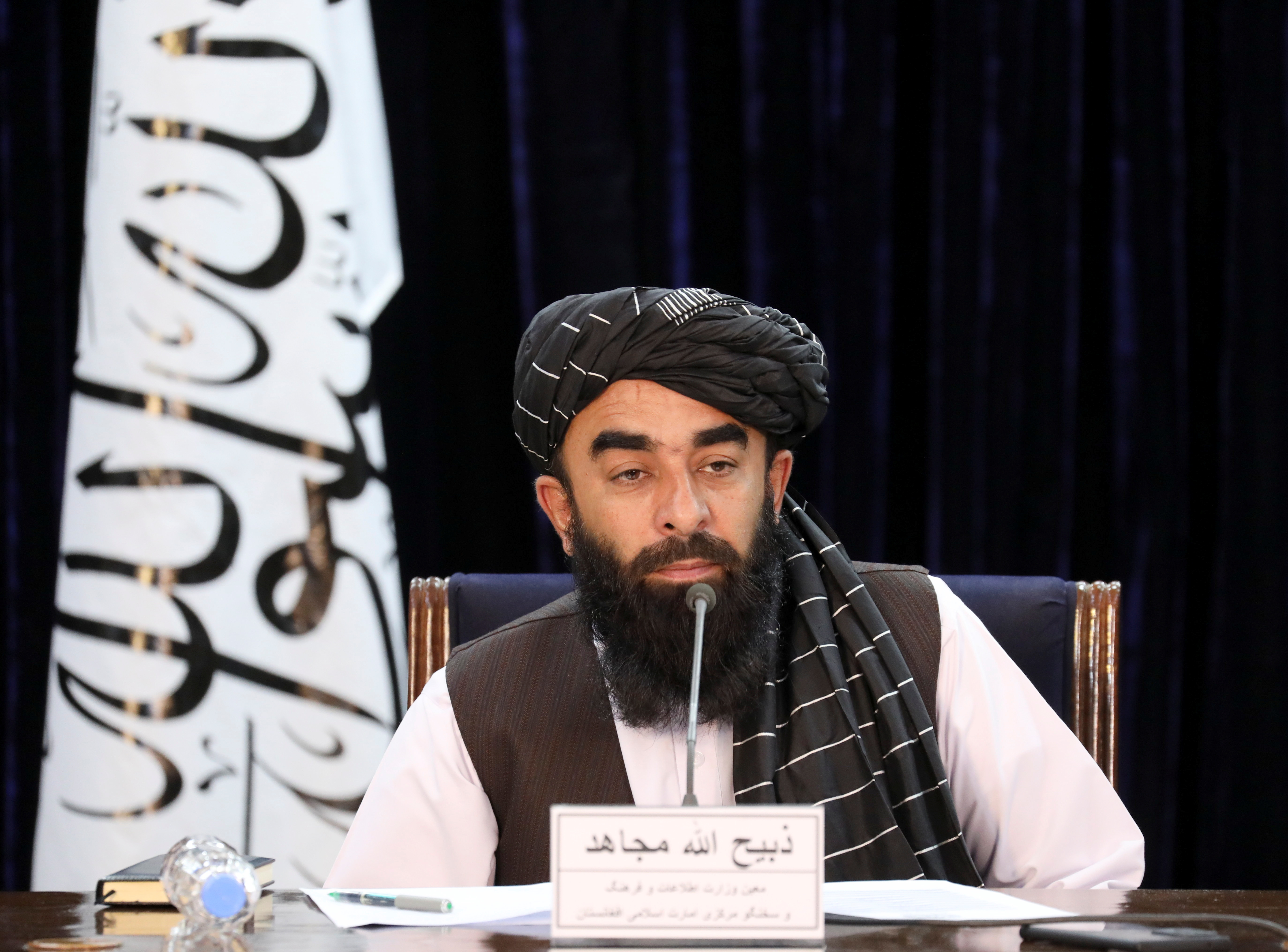 Taliban spokesman Zabihullah Mujahid speaks during news conference in Kabul