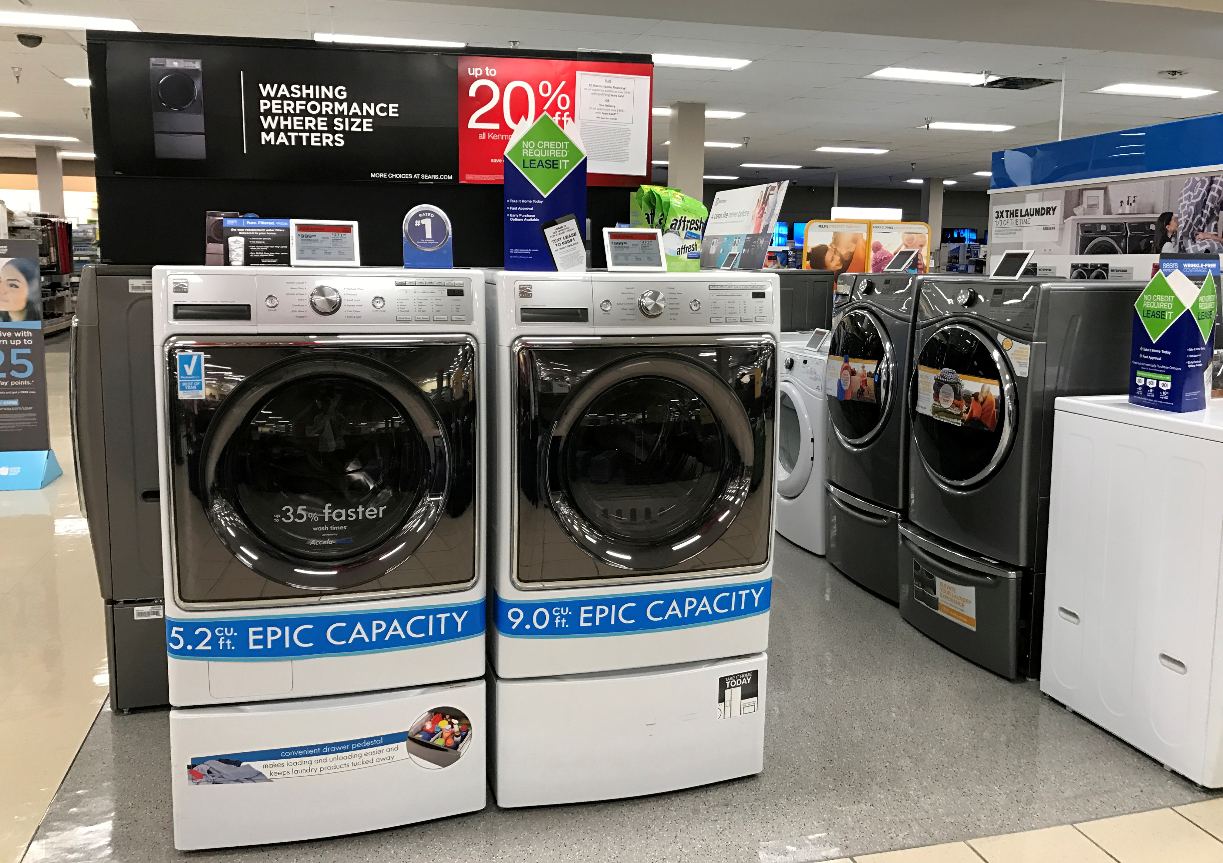 Sears Kenmore washing machines are shown for sale