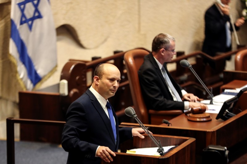 Naftali Bennett, Prime Minister-designate, speaks at the Knesset, Israel's parliament, during a special session whereby a confidence vote will be held to approve and swear-in a new coalition government, in Jerusalem
