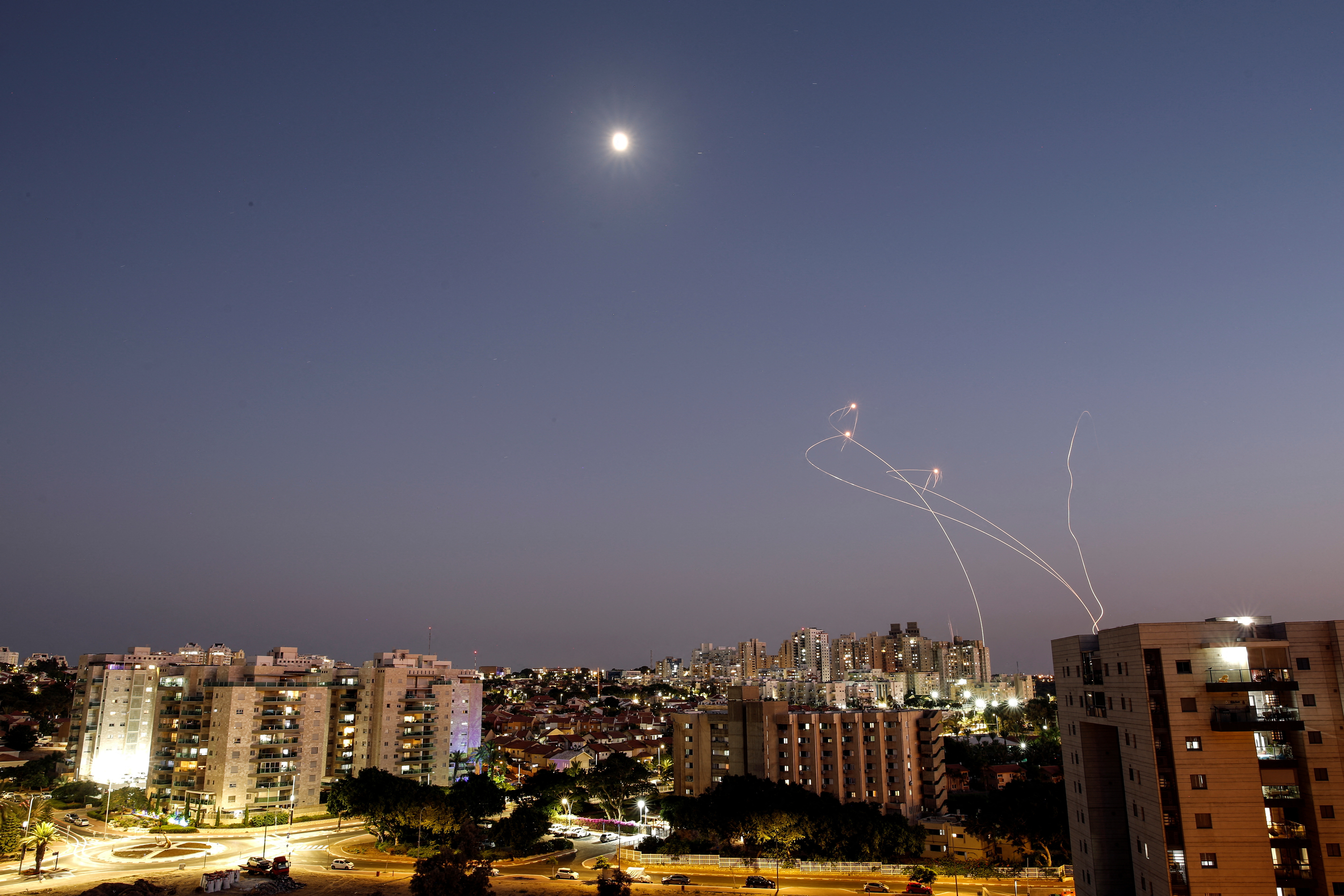 Streaks of light are seen as Israel's Iron Dome anti-missile system intercept rockets launched from the Gaza Strip towards Israel, as seen from Ashkelon