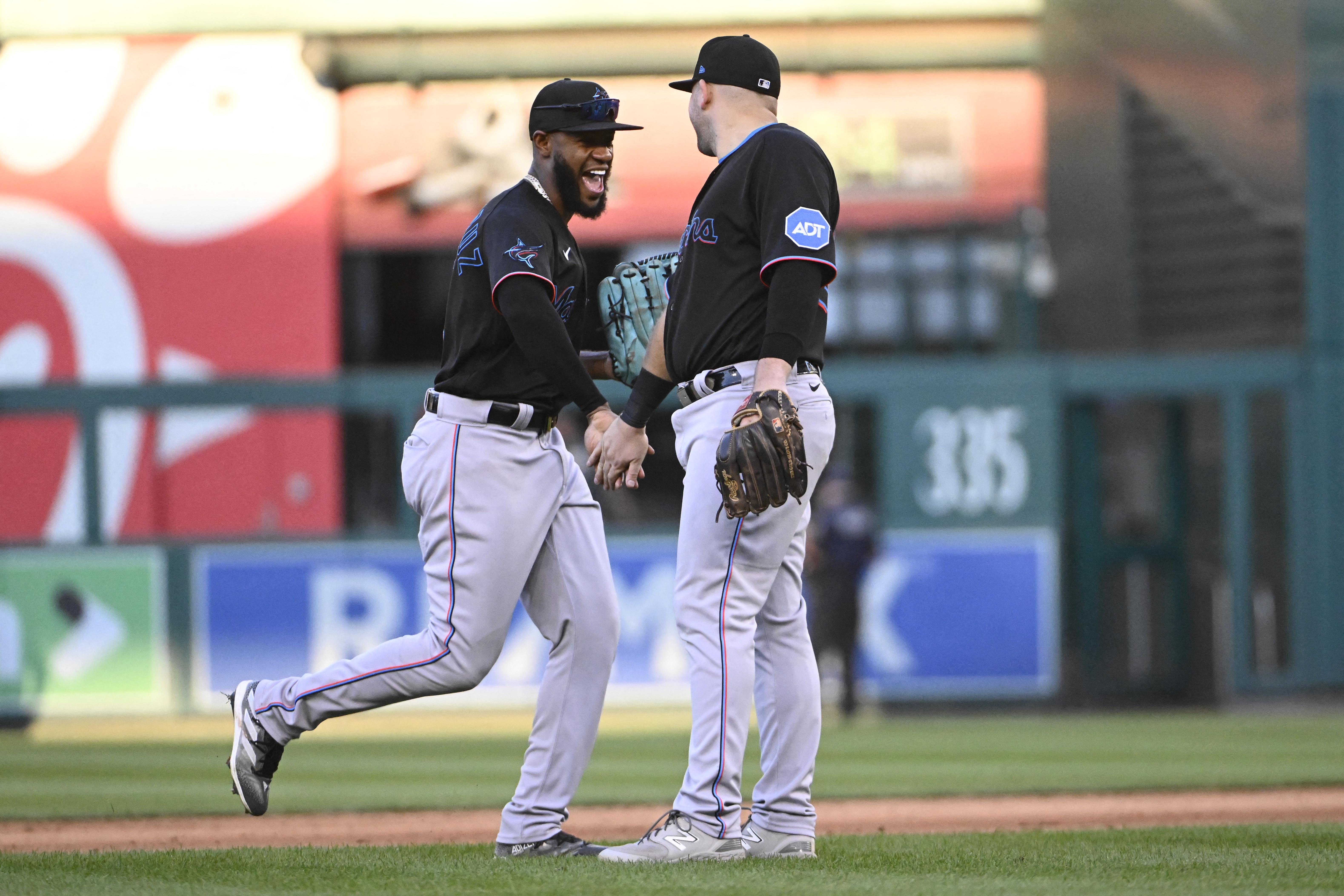 Cueto wins in his return as Burger hits 2 of the Marlins' 4 home runs in  win over the Nationals