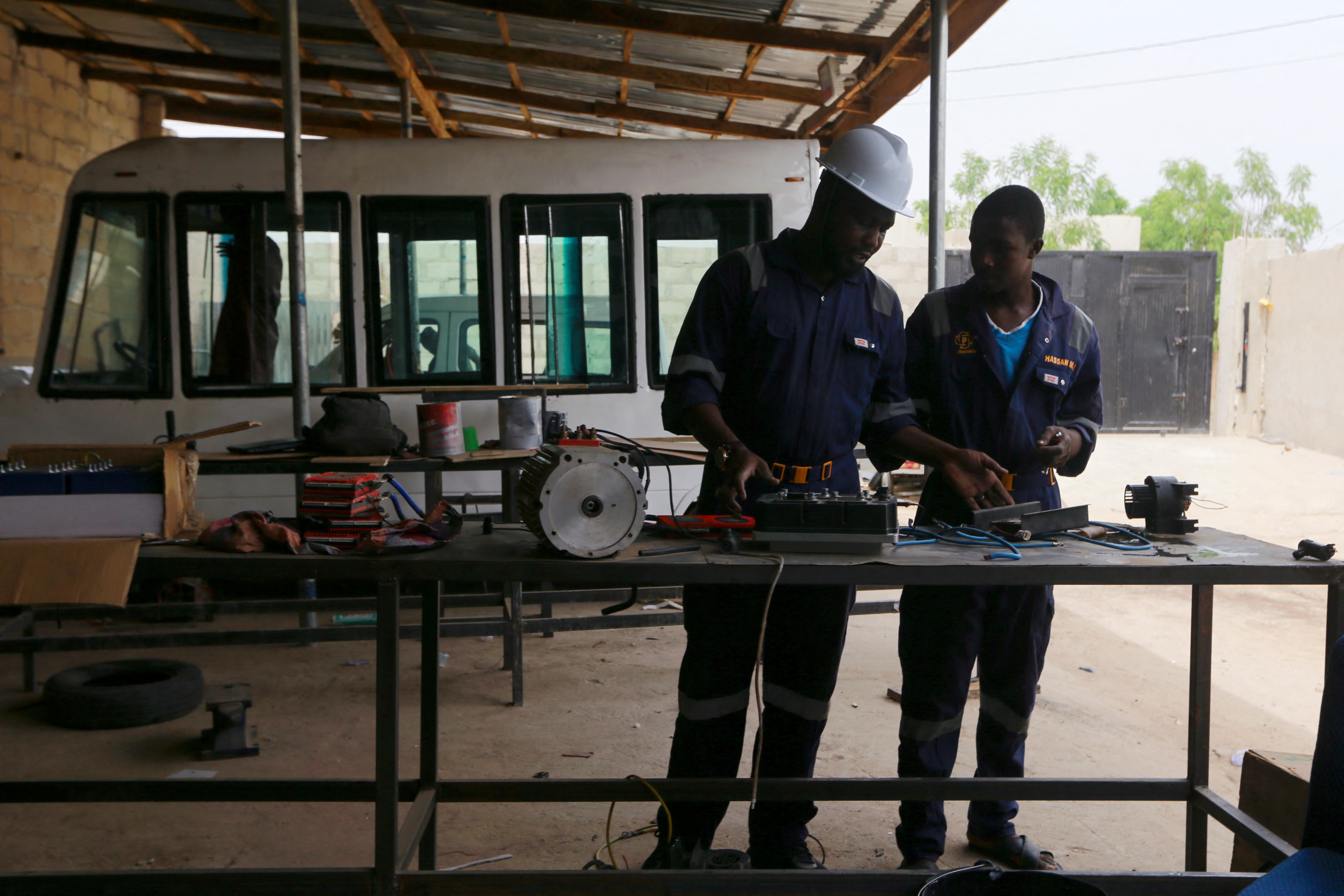 Adamu Mohammed works at the Phoenix Renewables workshop during production of solar battery-powered minibus in Maiduguri