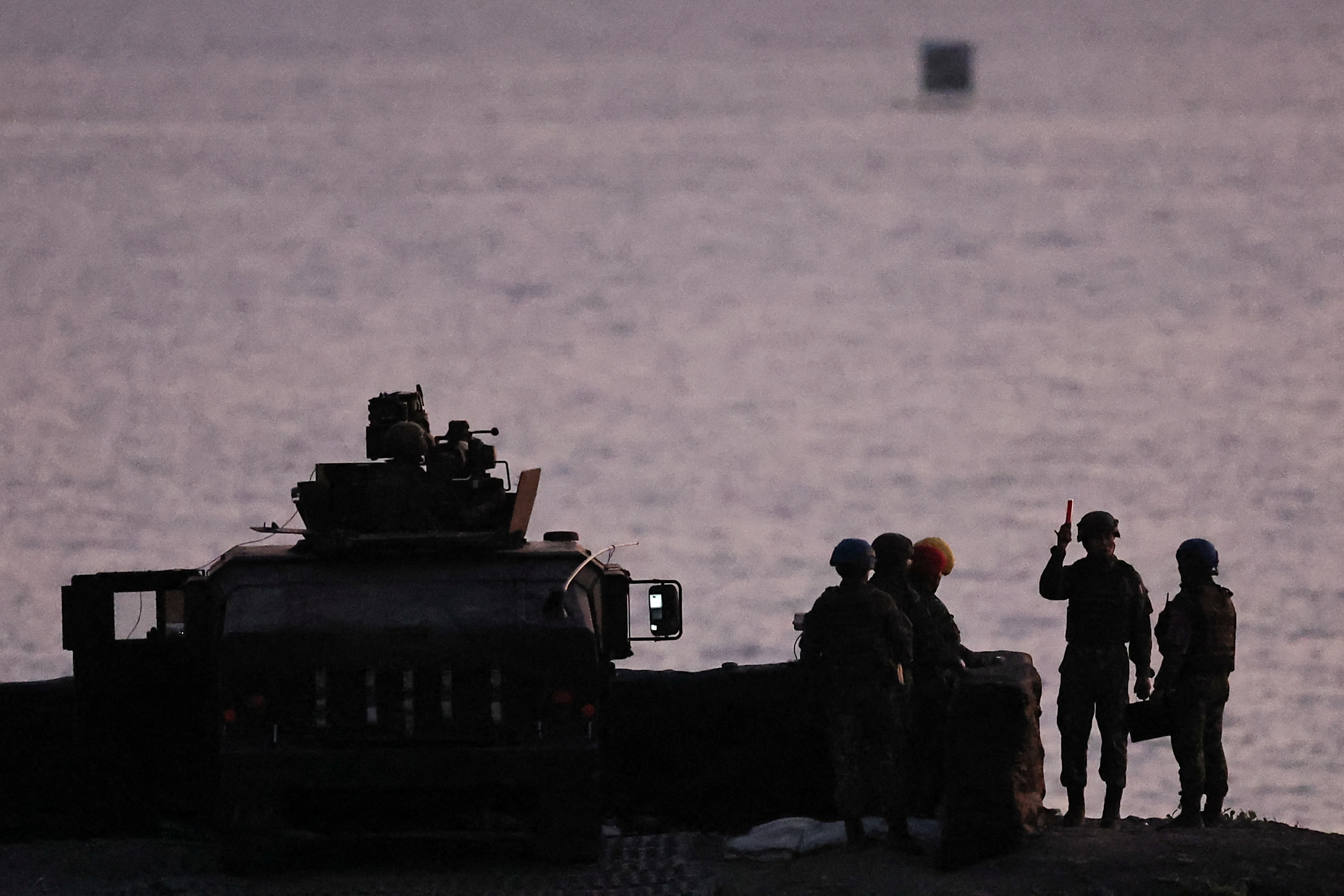 Soldiers prepare for a live fire drill at the Fangshan training grounds in Pingtung