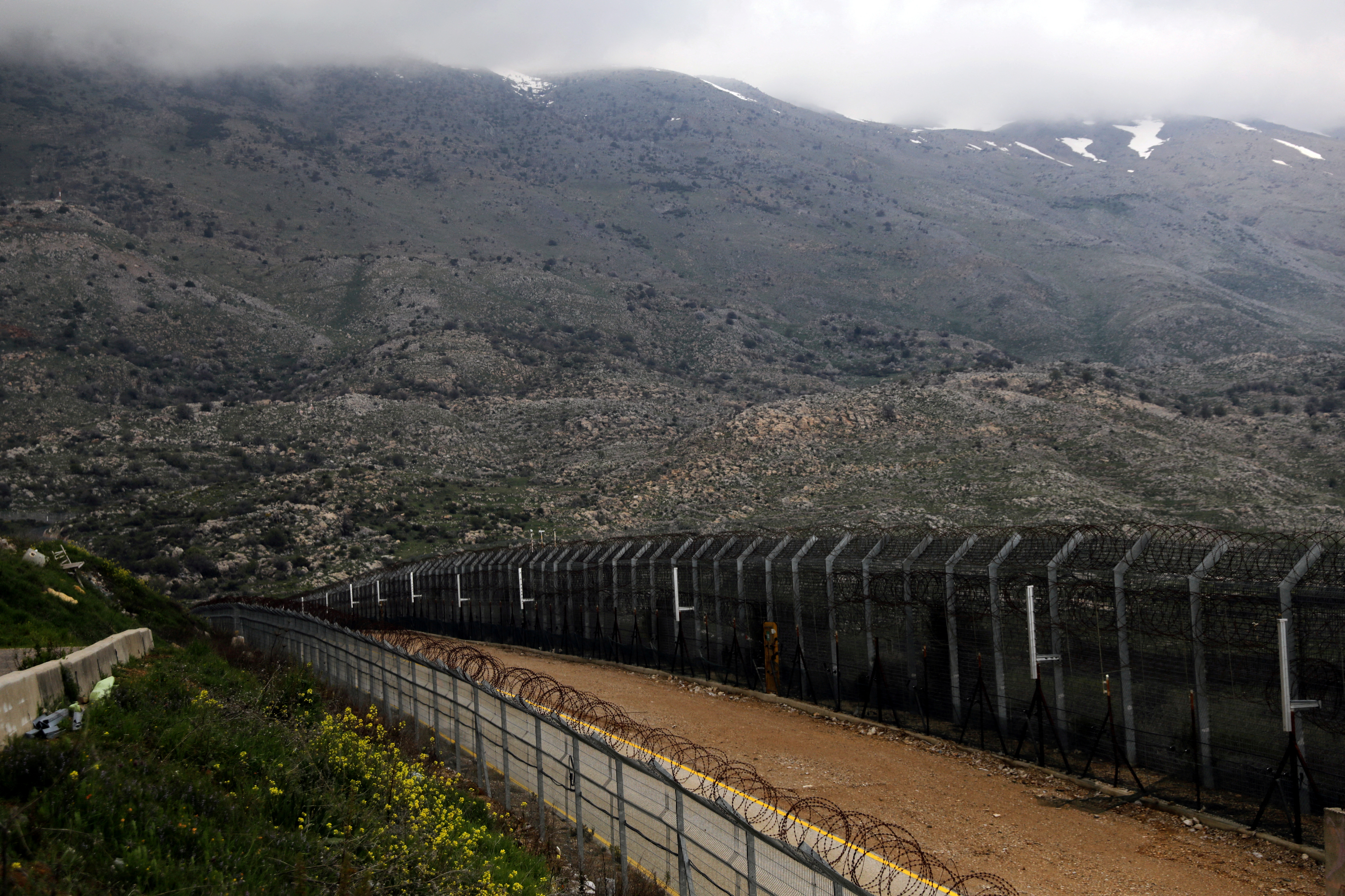 Fences are seen on the ceasefire line between Israel and Syria in the Israeli-occupied Golan Heights