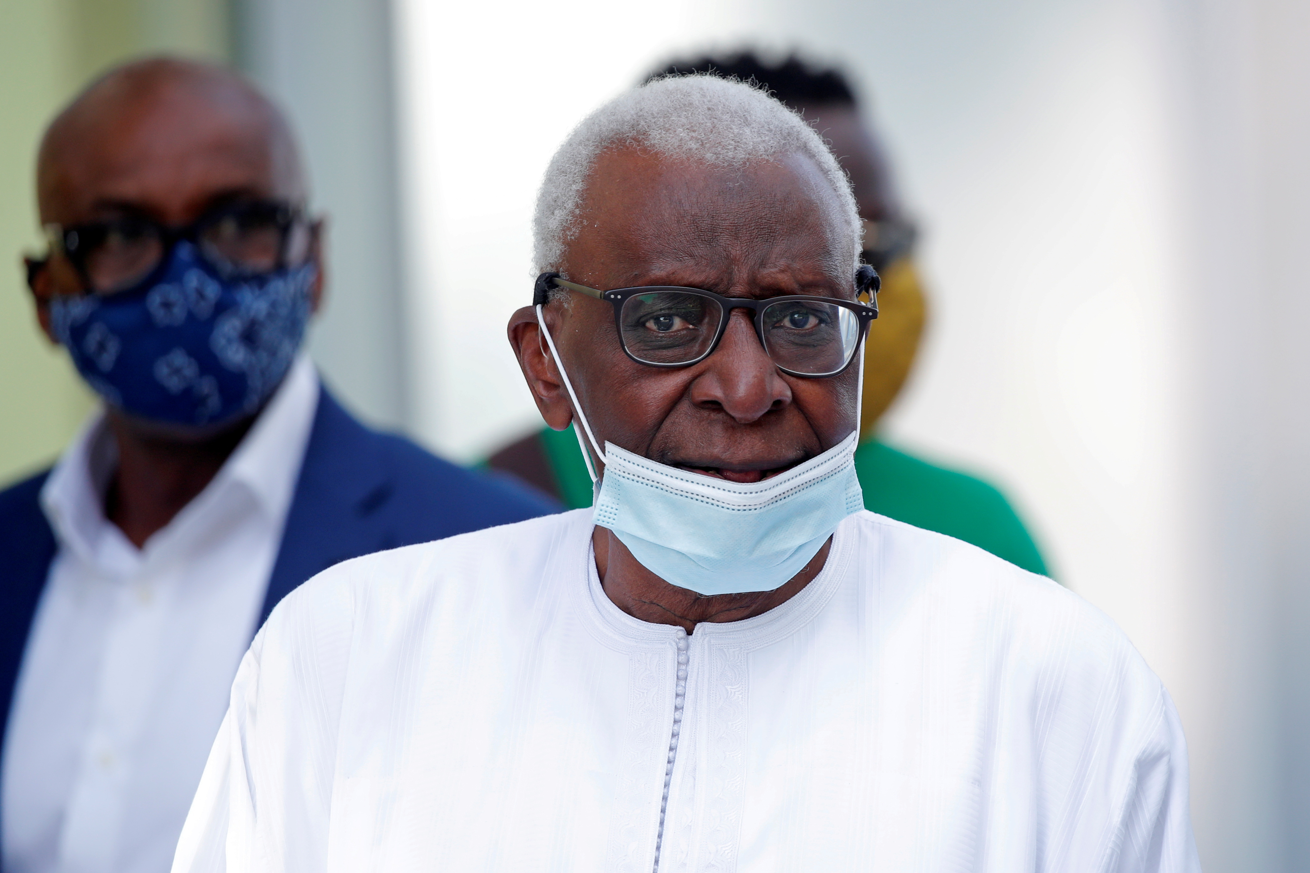   Former President of the International Association of Athletics Federations (IAAF) Lamine Diack, wearing a face mask, leaves after the verdict in his trial at the Paris courthouse, France, September 16, 2020. REUTERS/Charles Platiau/File Photo