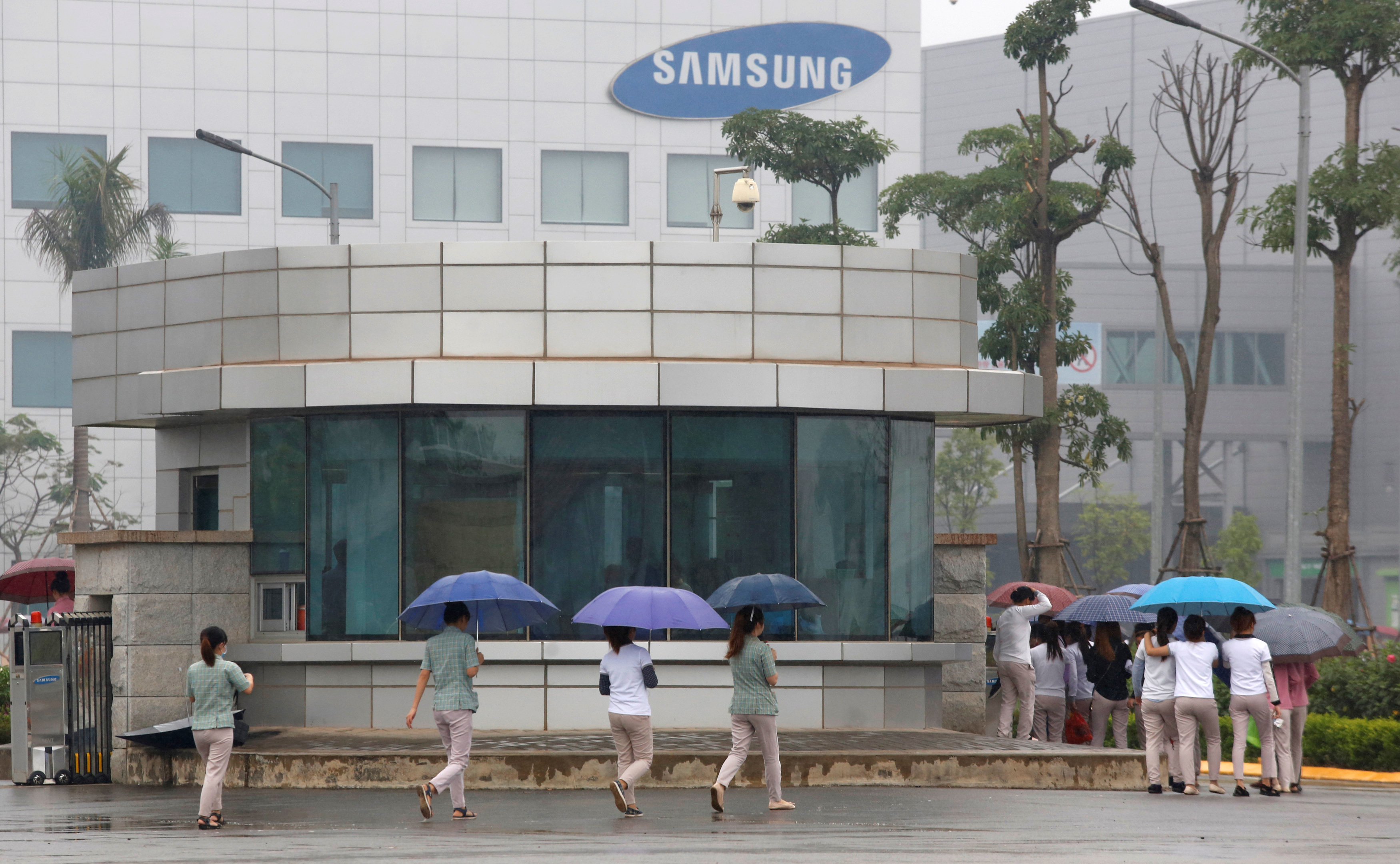 Workers make their way to work at a Samsung factory in Thai Nguyen province, north of Hanoi, Vietnam
