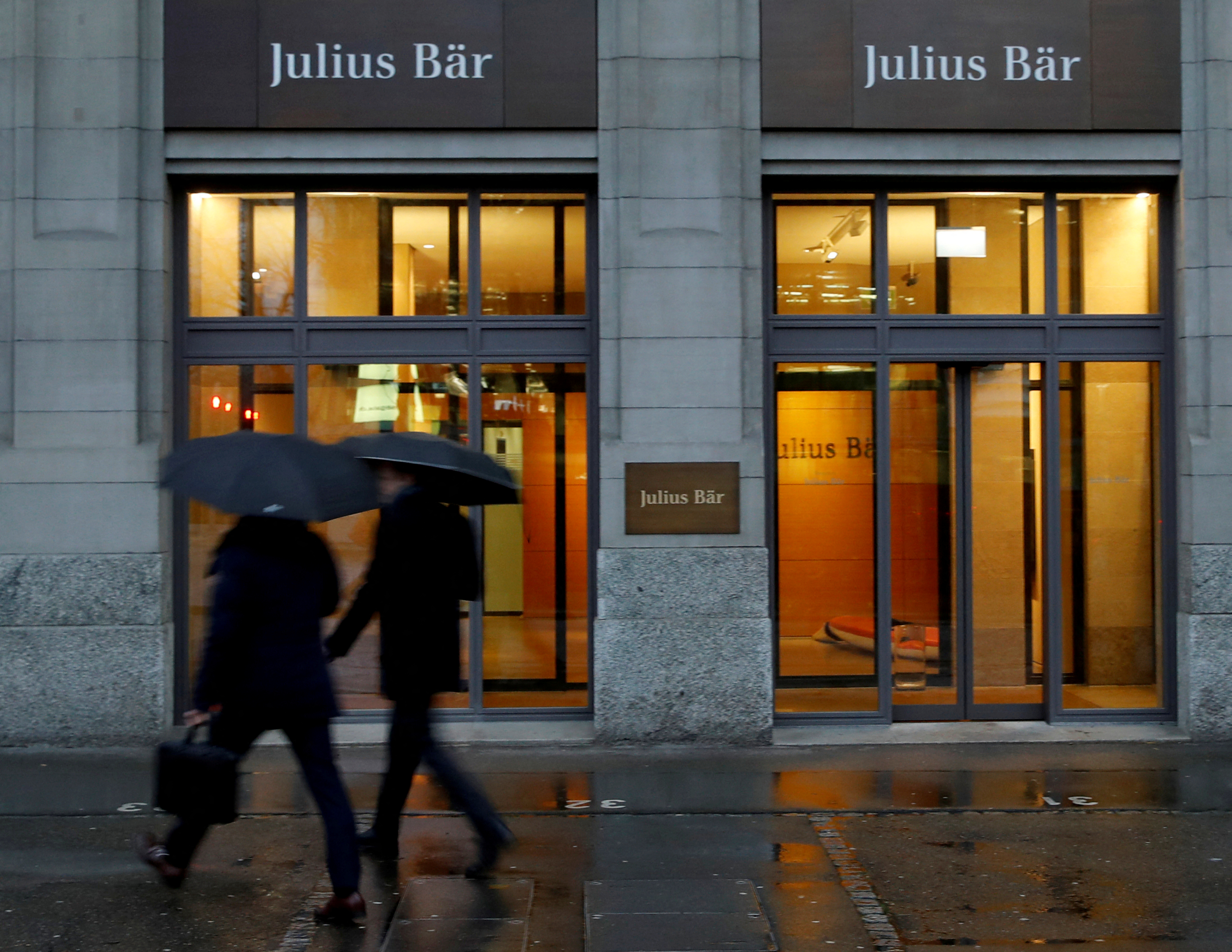 People walk past a branch of Swiss bank Julius Baer in Zurich