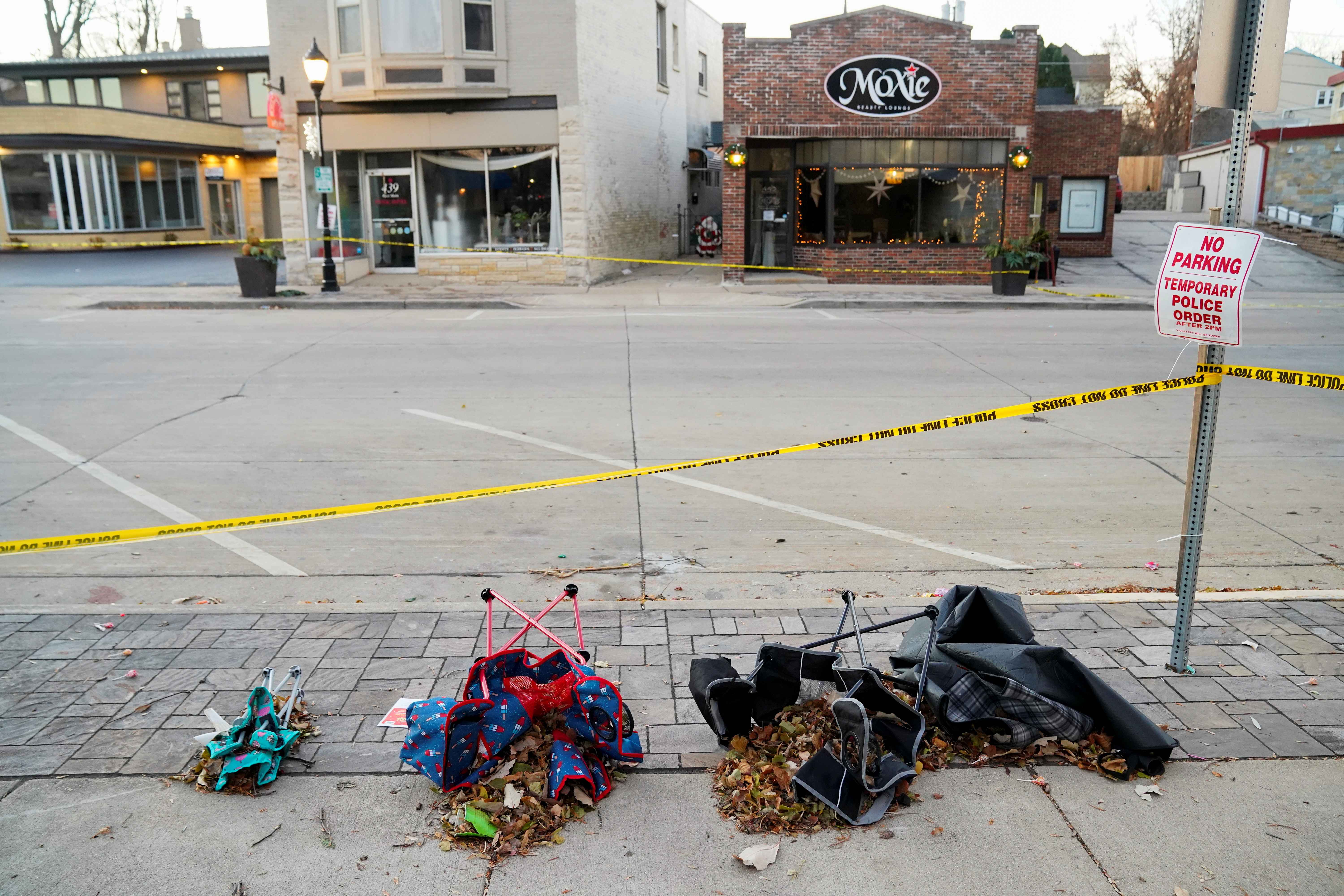Chairs are left abandonded on Main Street the morning after a car plowed through a holiday parade in Waukesha, Wisconsin, U.S., November 22, 2021.  REUTERS/Cheney Orr
