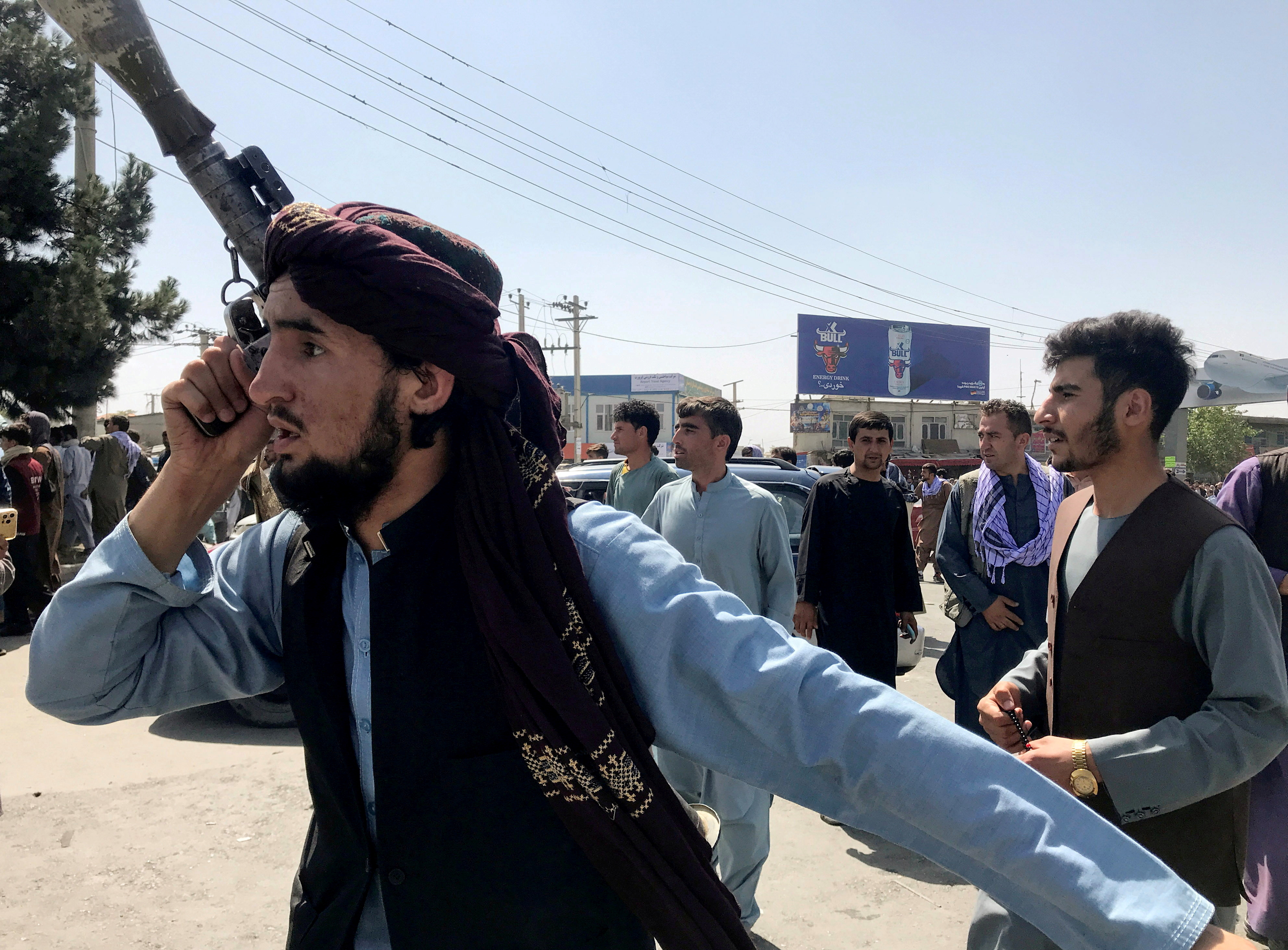 A member of Taliban forces inspects the area outside Hamid Karzai International Airport in Kabul, Afghanistan August 16, 2021. REUTERS/Stringer 
