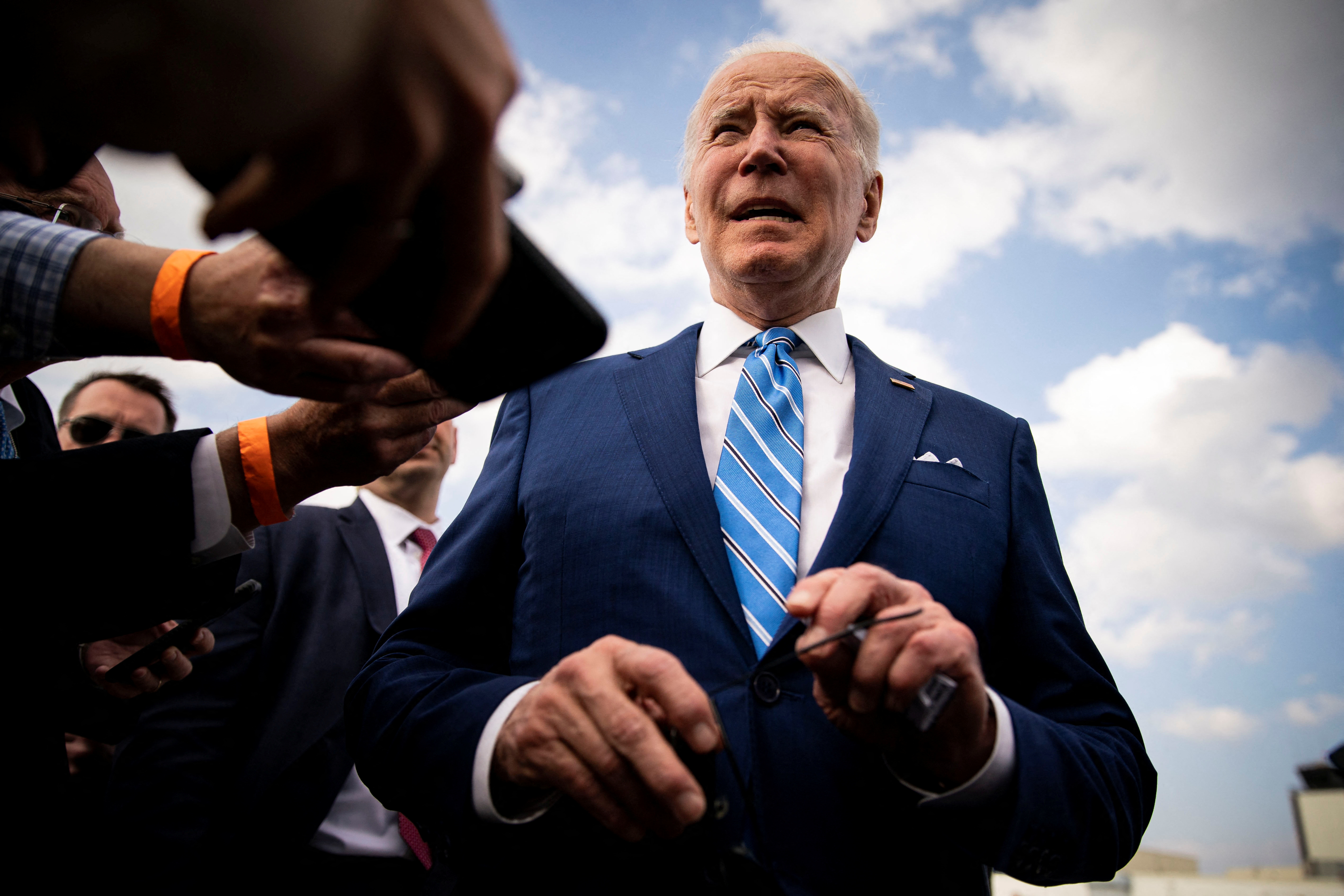 U.S. President Biden speaks to reporters while departing at Des Moines International Airport in Des Moines