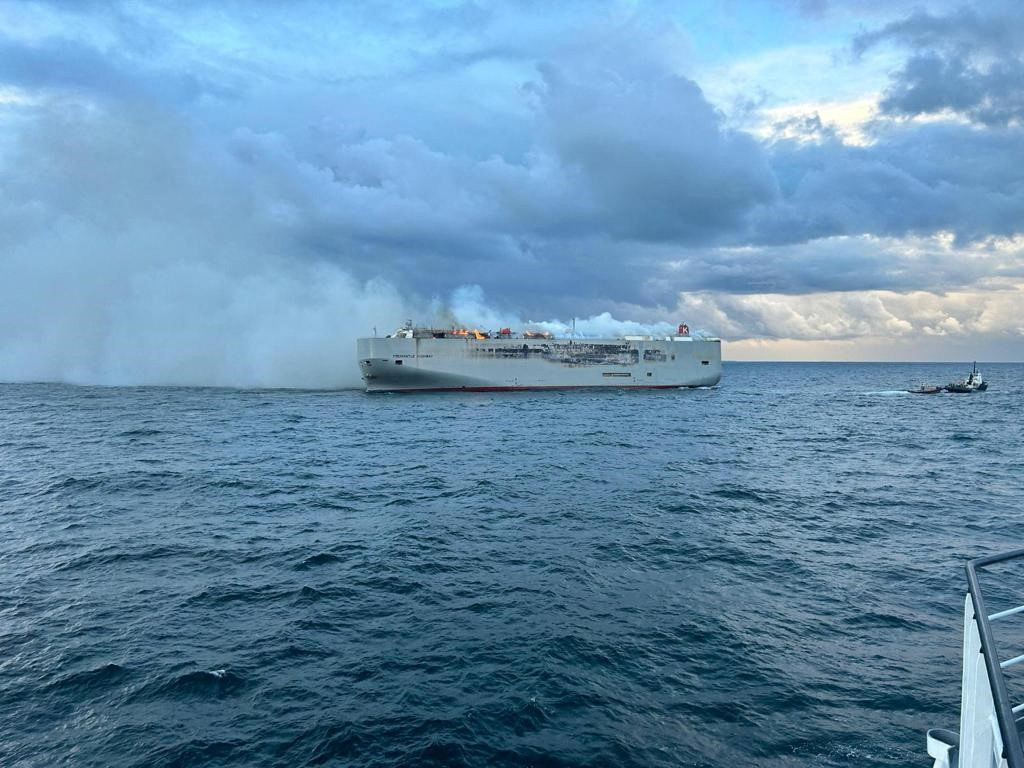 Smoke rises as a fire broke out on the cargo ship Fremantle Highway, at sea