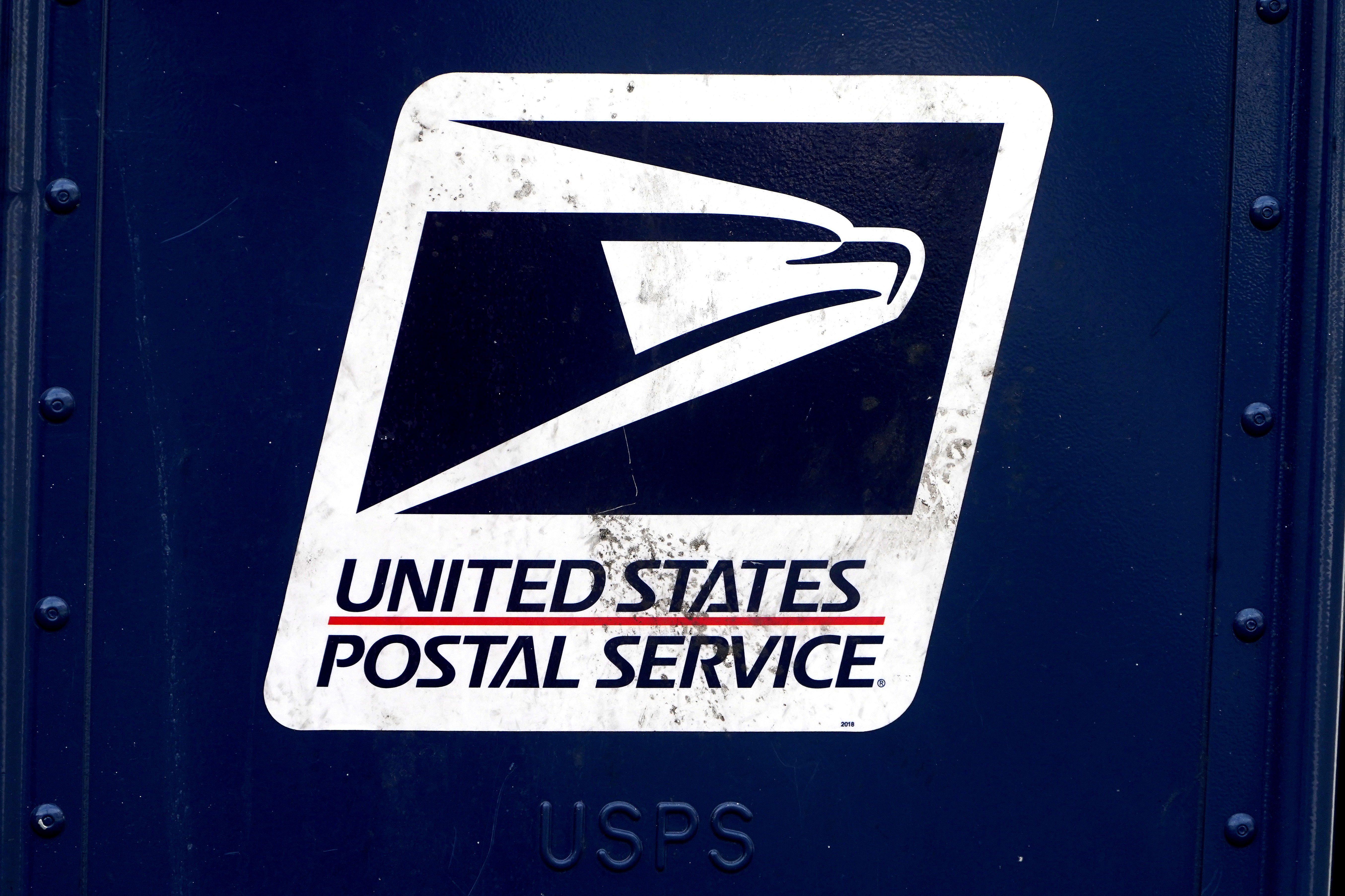 A U.S. Postal Service (USPS) logo is pictured on a mail box in the Manhattan borough of New York City, New York, U.S., August 21, 2020. REUTERS/Carlo Allegri