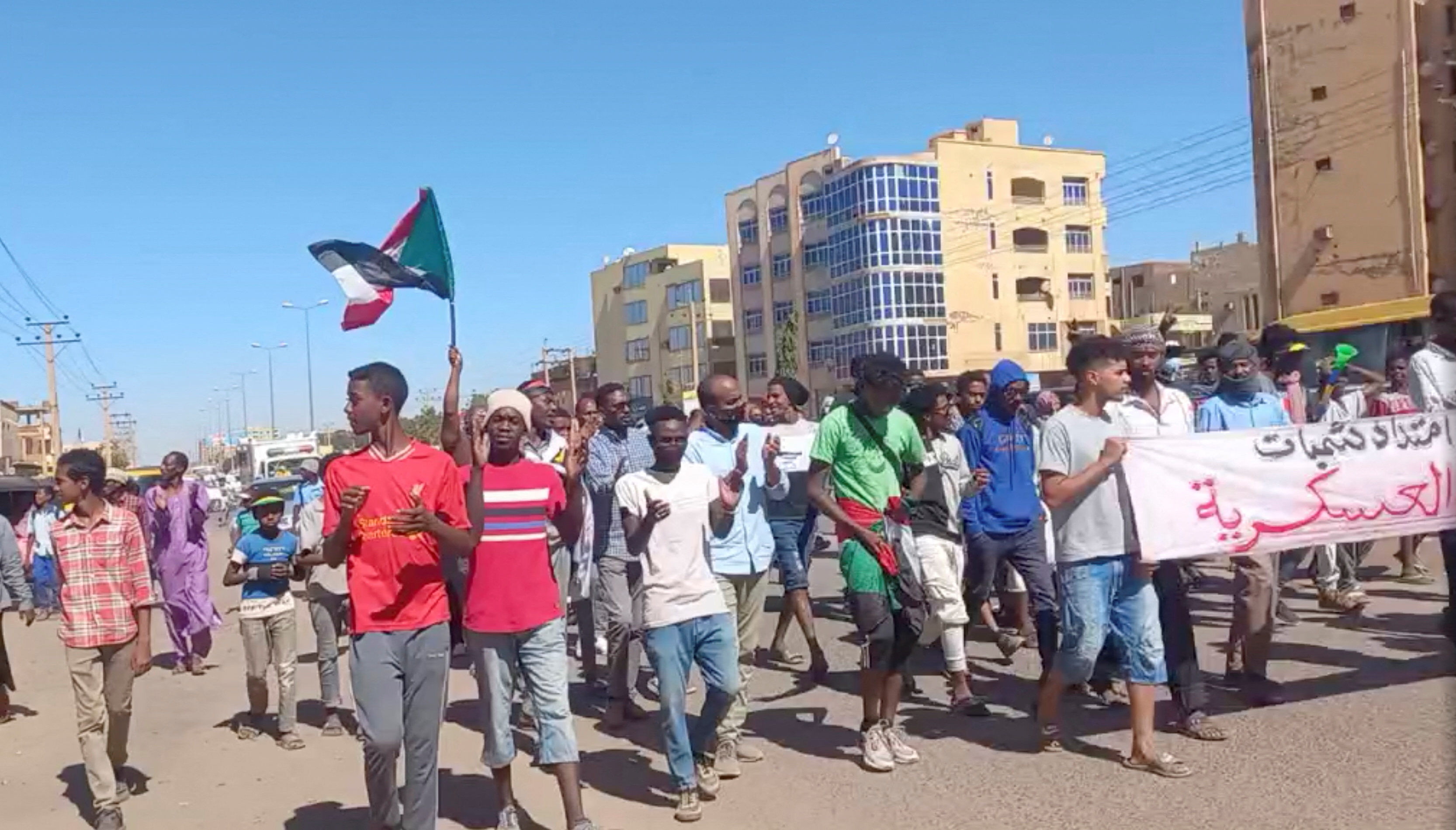 Protesters opposed to military rule march in Khartoum North, Sudan December 30, 2021 in this screengrab obtained from a social media video. Resistance Committees Atbara/Handout via REUTERS 