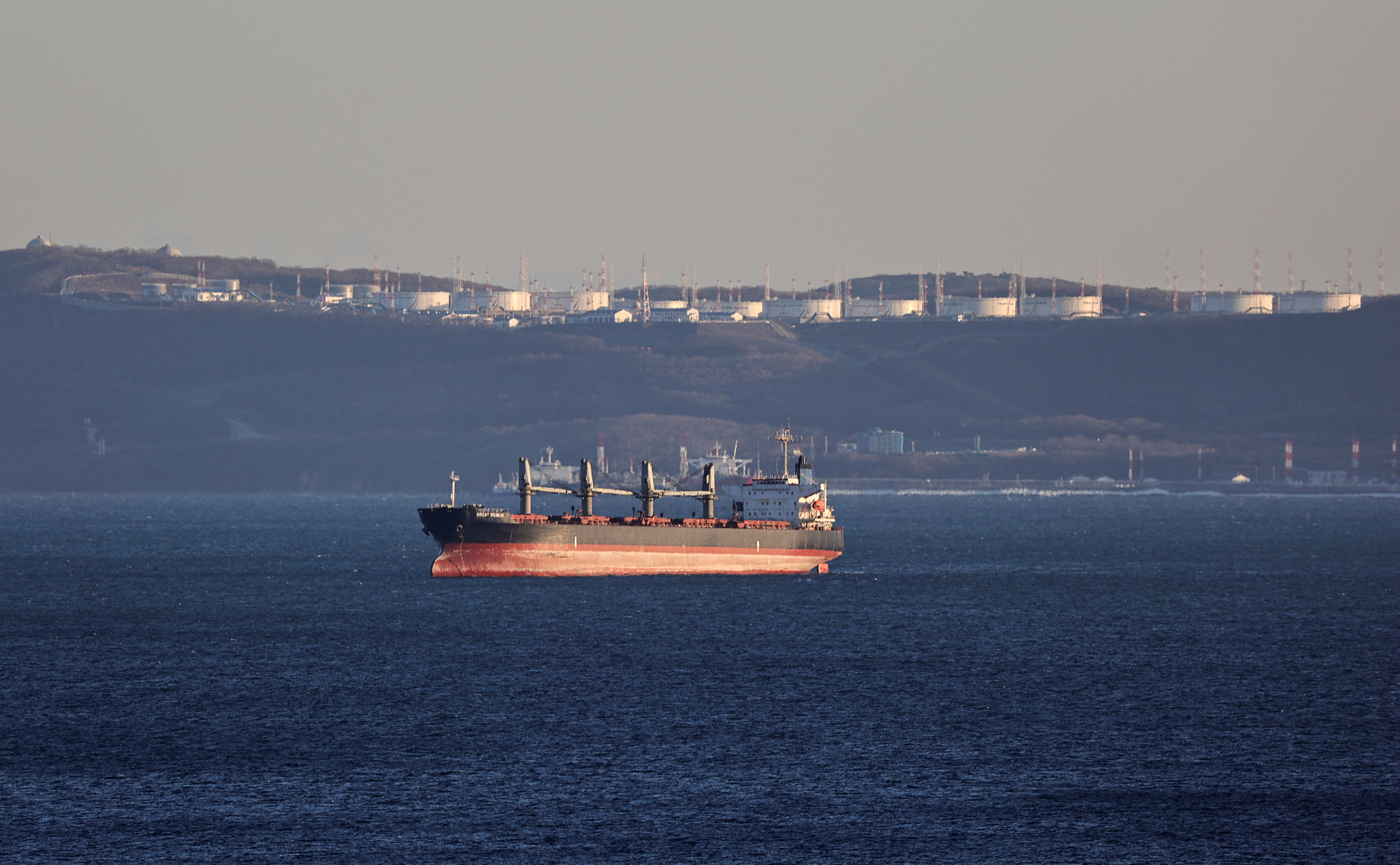 A bulk carrier sails near the crude oil terminal Kozmino in Nakhodka Bay