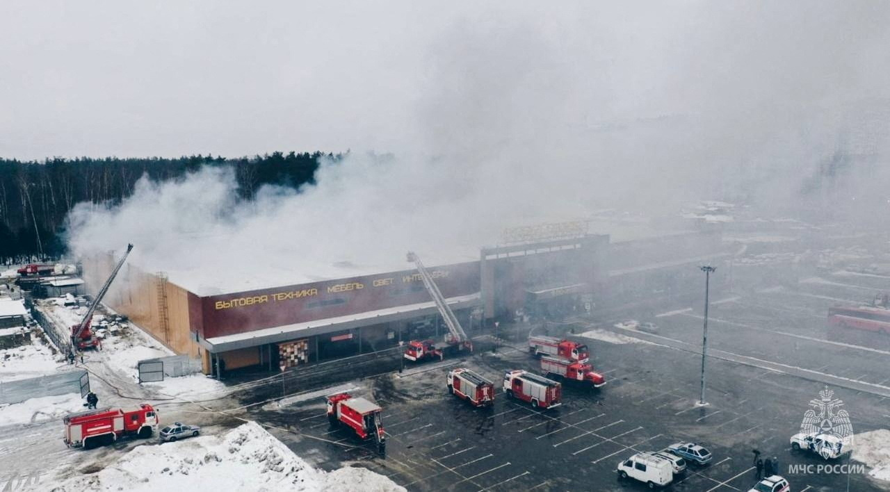 Firefighters work to extinguish a fire at a construction supplies hypermarket in the town of Balashikha