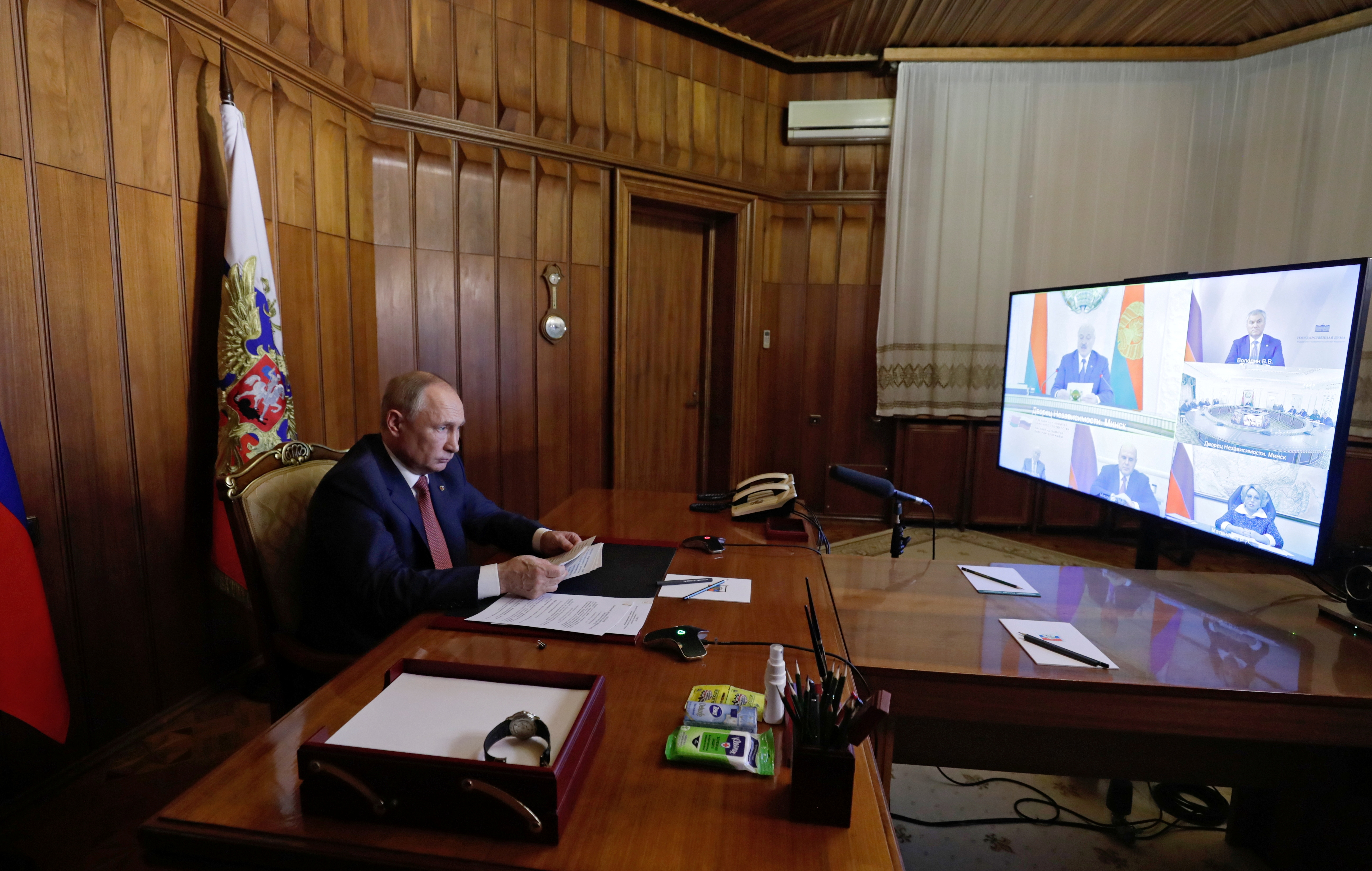 Russian President Vladimir Putin attends a meeting via a video link in Sevastopol