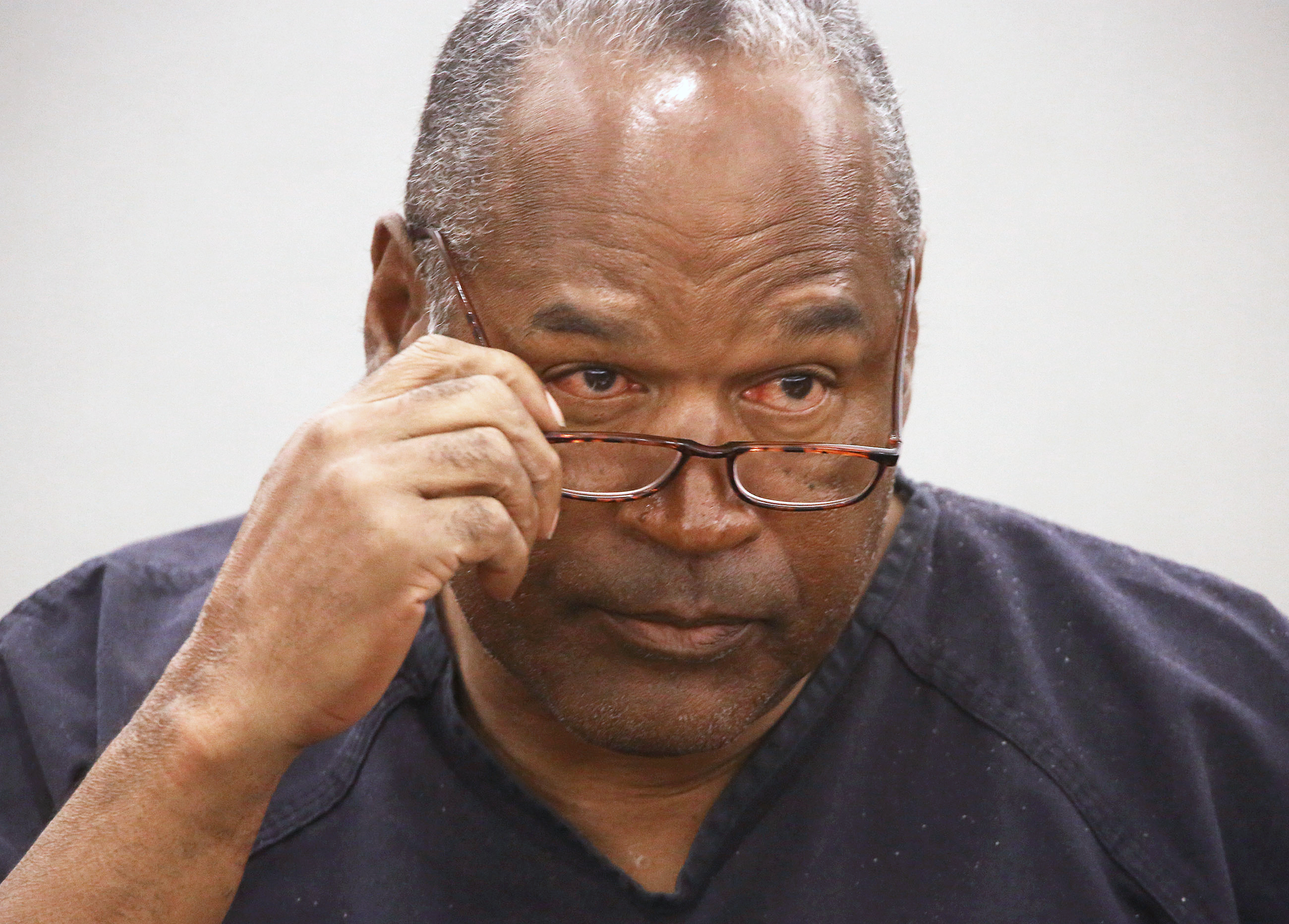 O.J. Simpson takes his glasses off during his evidentiary hearing testimony in Clark County District Court in Las Vegas