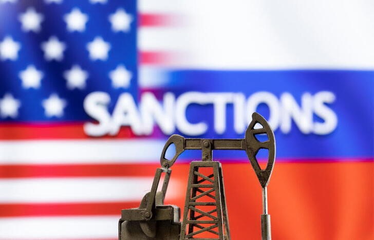 Illustration shows pump jack in the front word "Sanctions", U.S. and Russia flag colours