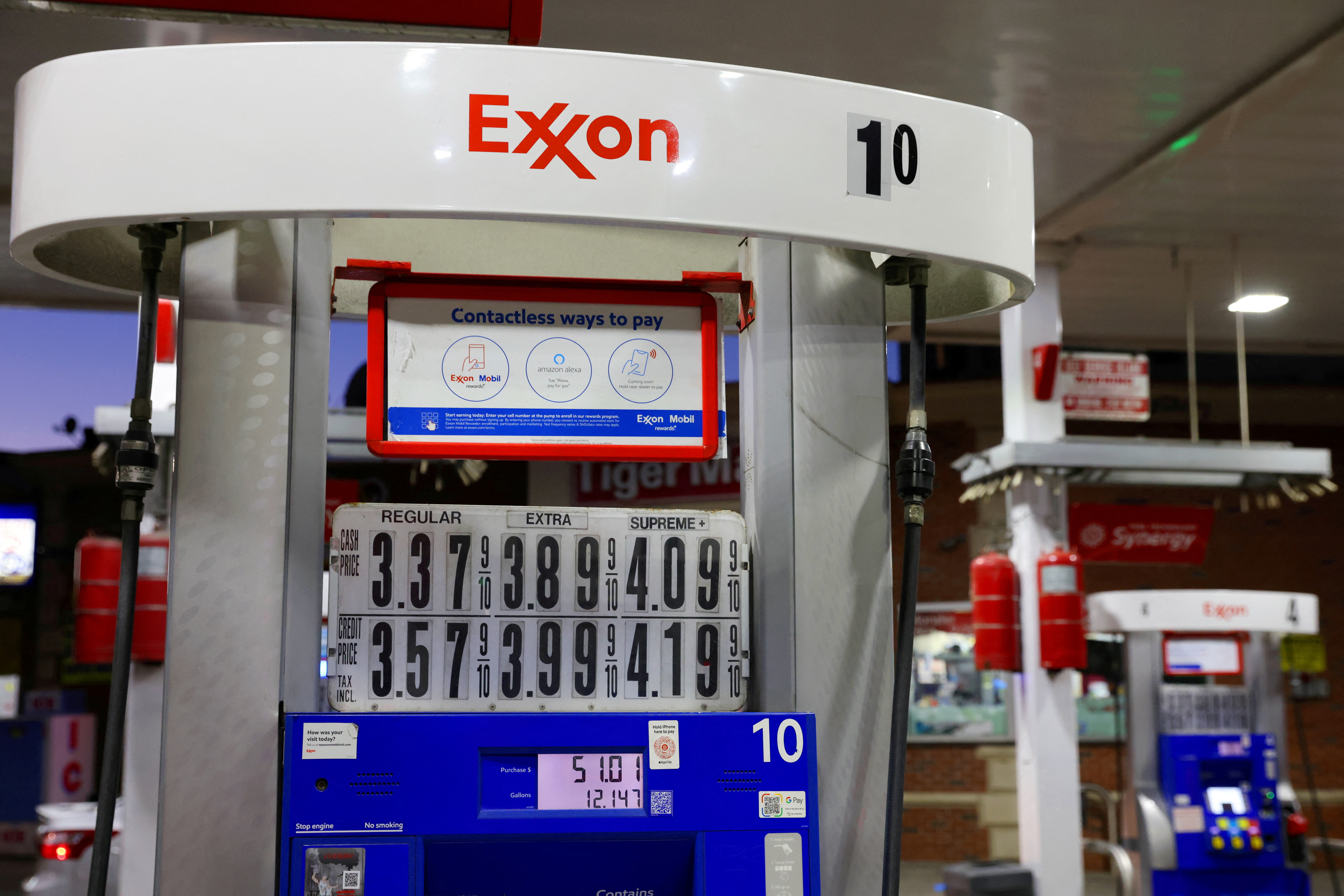 Signage is seen on a gasoline pump at an Exxon gas station in Brooklyn, New York City